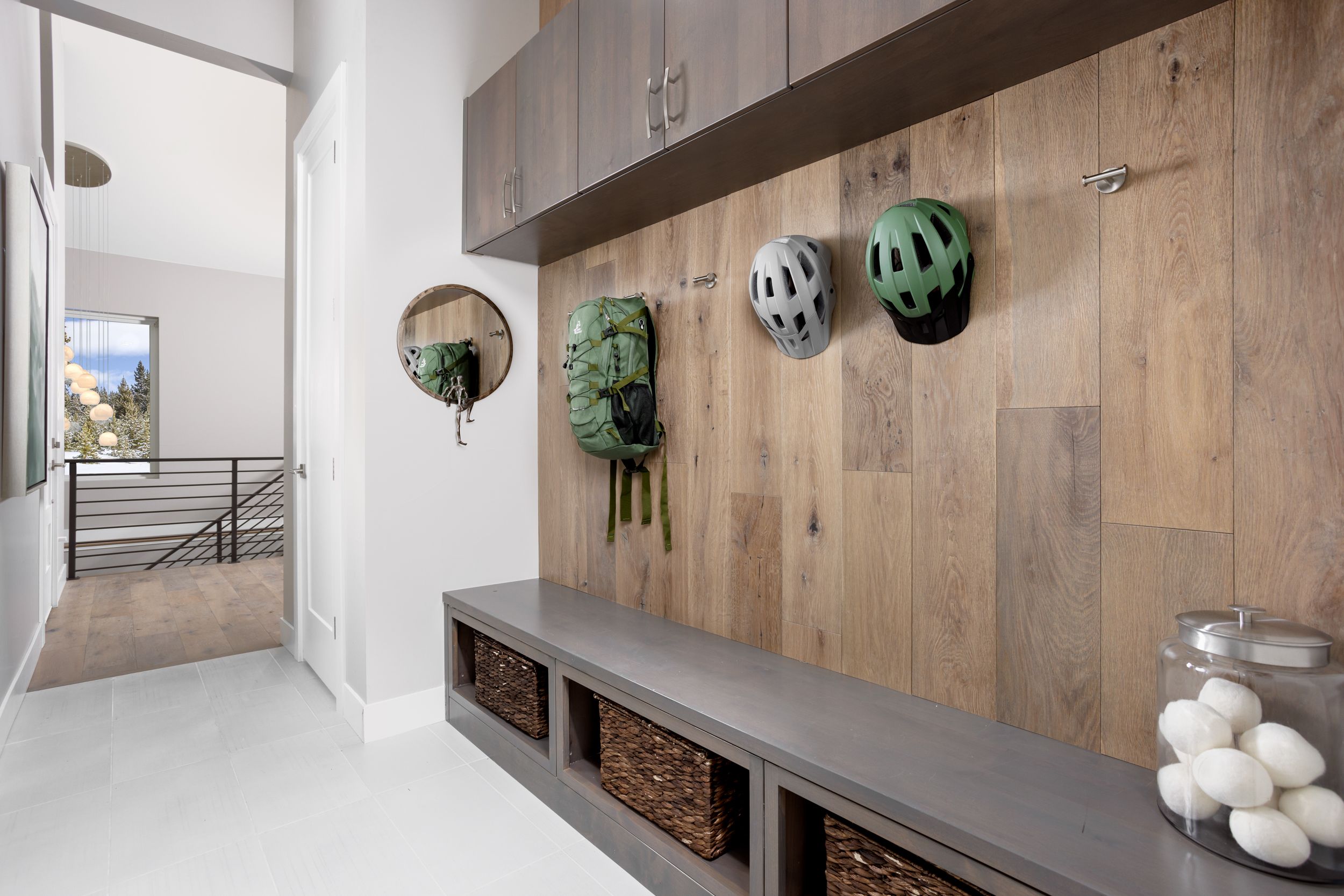 The Osprey entryway features a convenient drop zone with built-in storage, offering a simple and organized space to keep everyday essentials in place as you come and go.