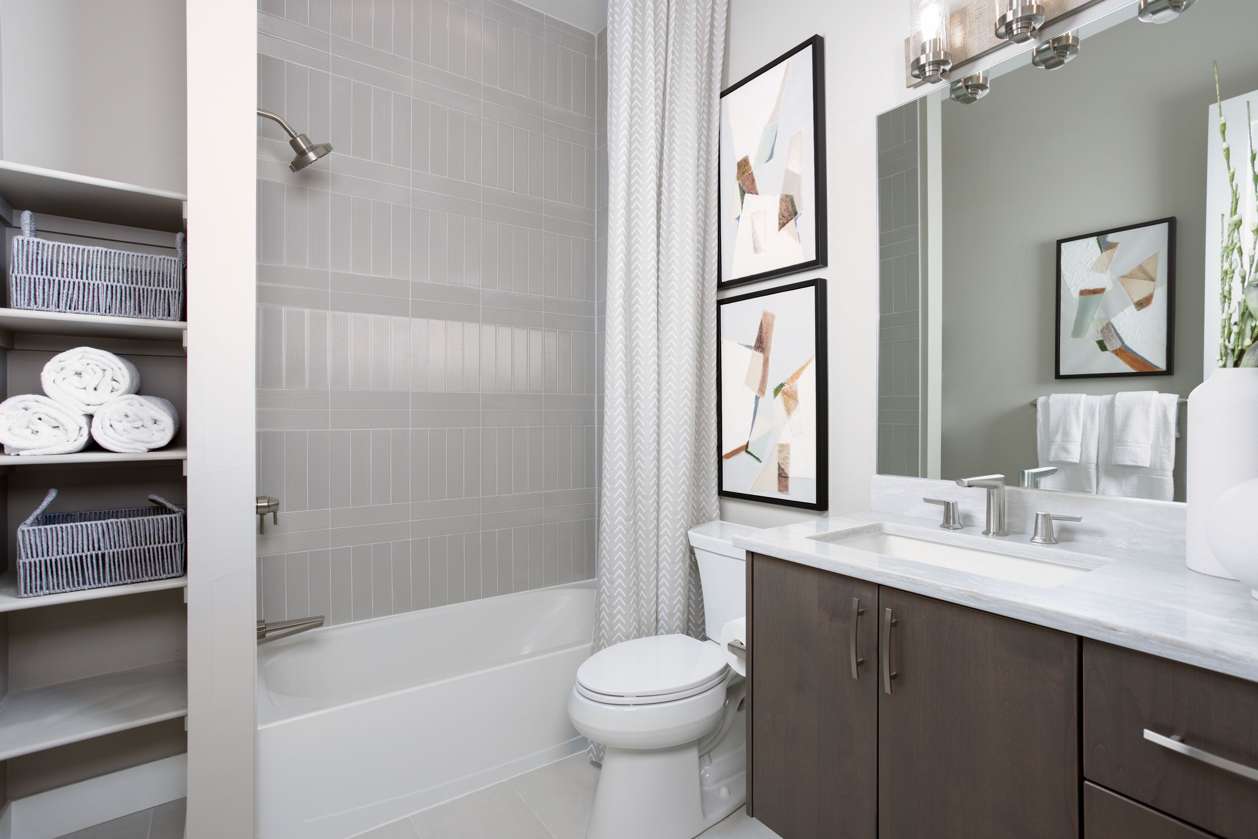 Bath 3 is a shared space on the lower level, thoughtfully designed for convenience and easy access from the surrounding bedrooms and living areas.