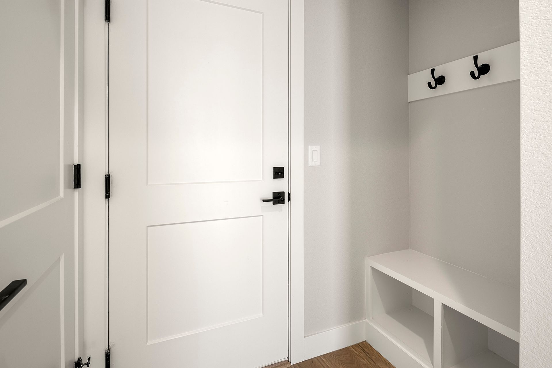 Mud space and storage closet near garage entry