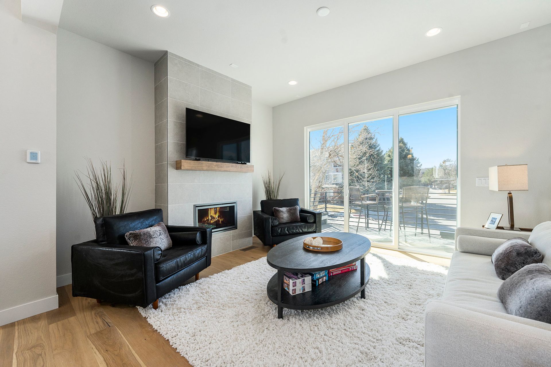 Large, bright and open living room with 10 ft ceiling, gas fireplace and south facing balcony
