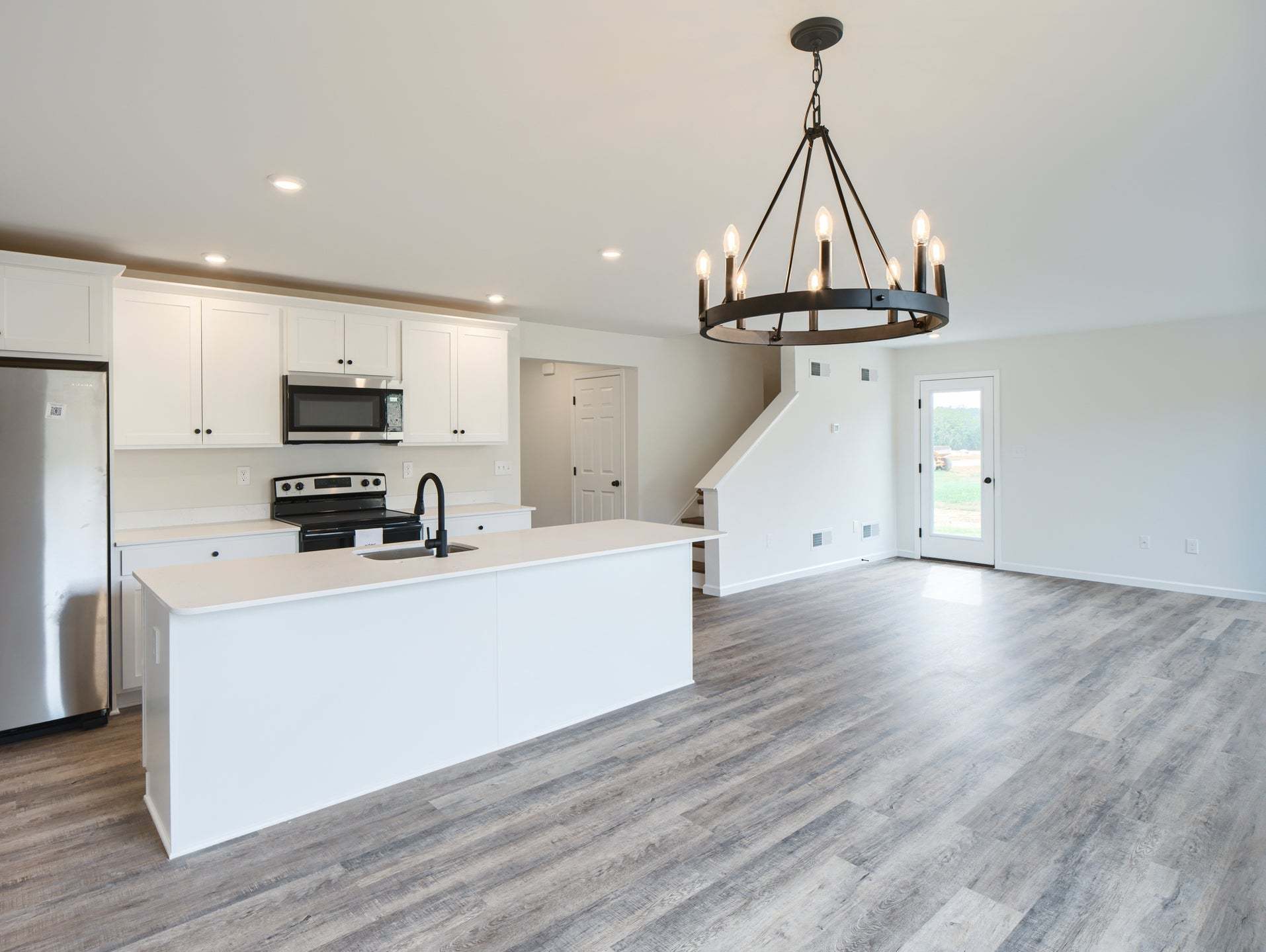 Standard Kitchen W/Upgrades, Dining Area, and Family Room
