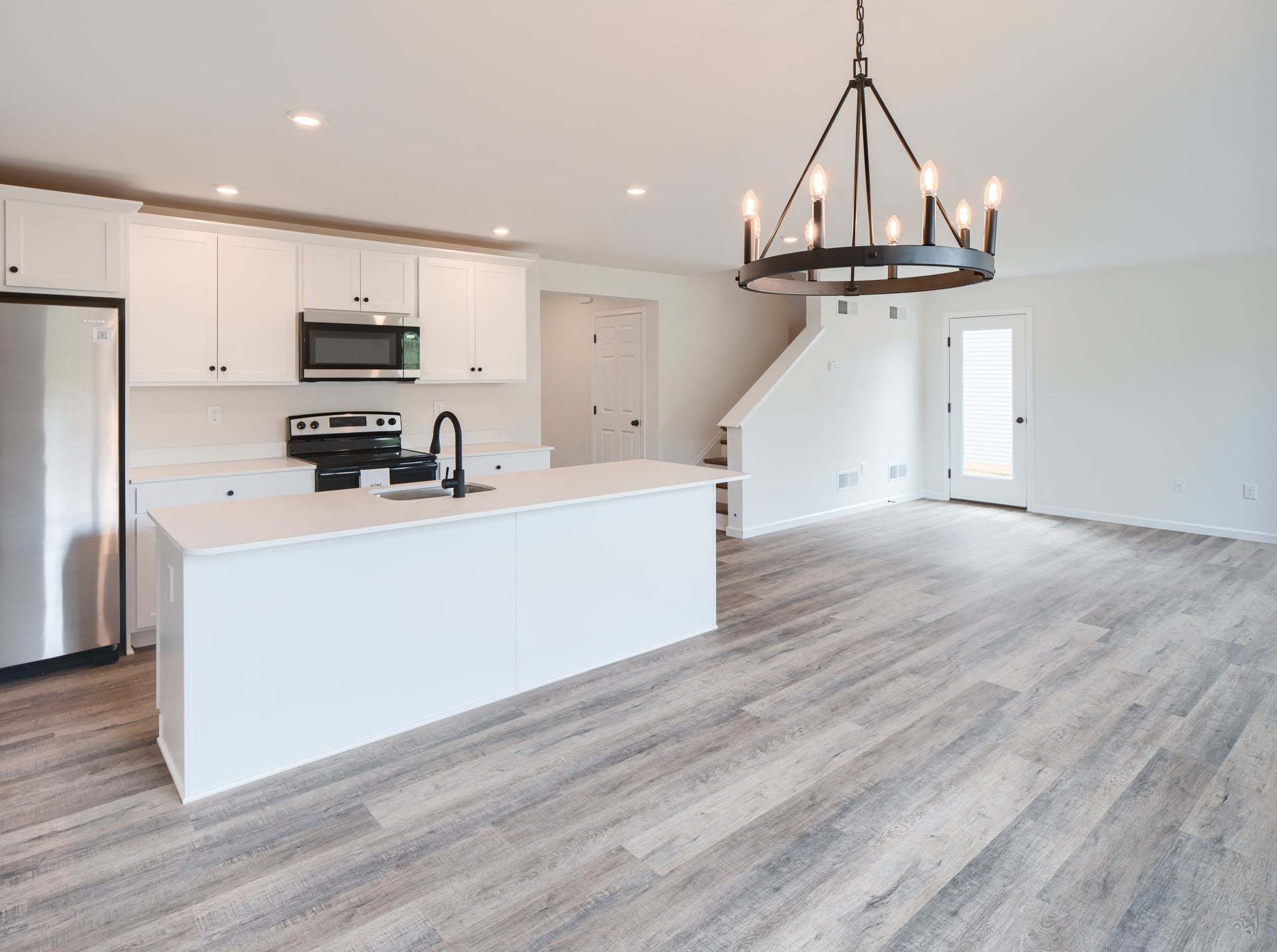 Standard Kitchen W/Upgrades, Dining Area, and Family Room