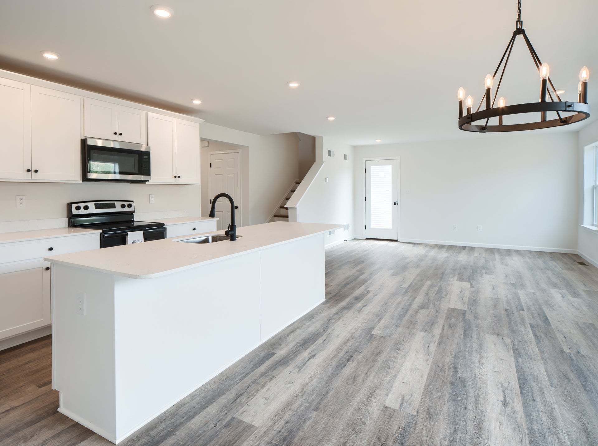 Standard Kitchen W/Upgrades, Dining Area, and Family Room