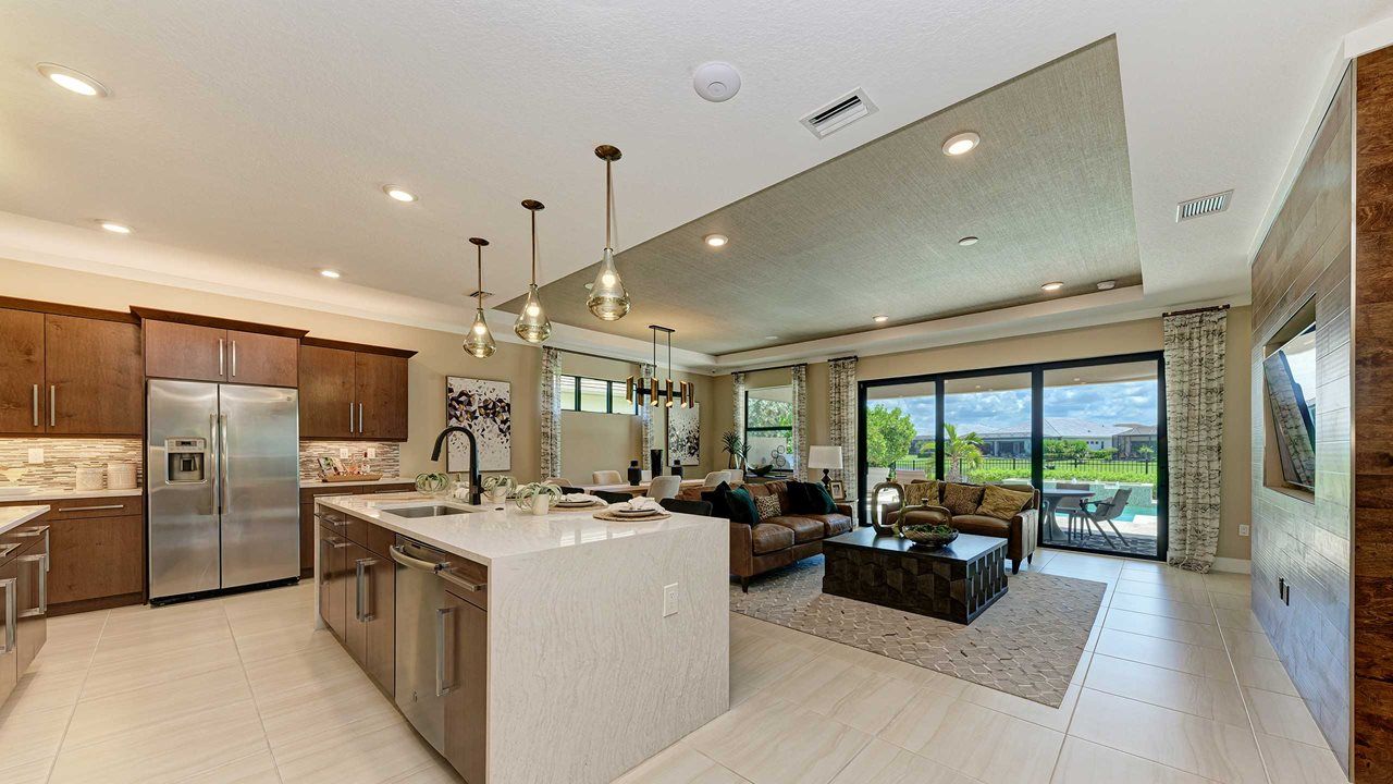 Bahia Model Home | Island Kitchen into Great Room