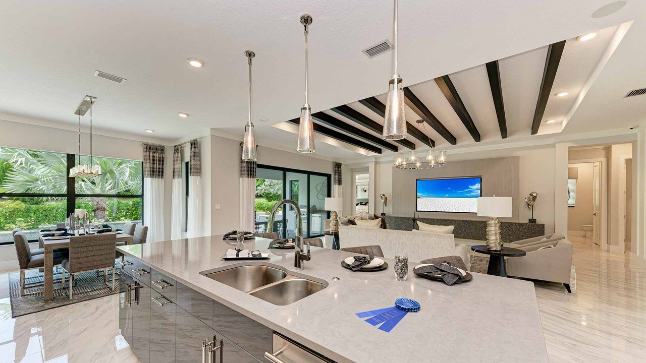 Palm Beach Model Home | Island Kitchen into Main Living