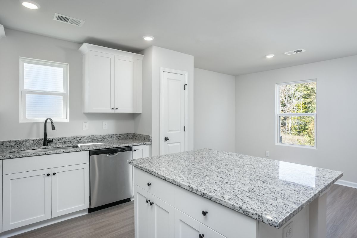 The kitchen overlooks the living area