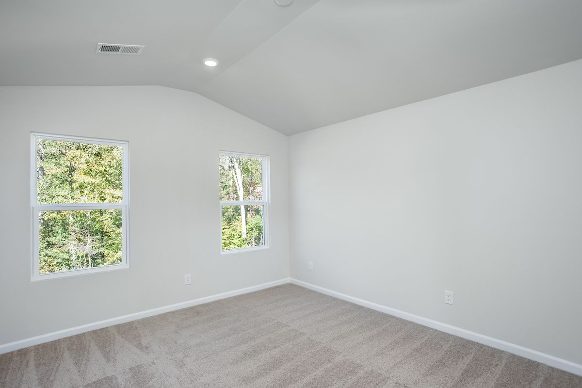 The master bedroom has cathedral ceilings