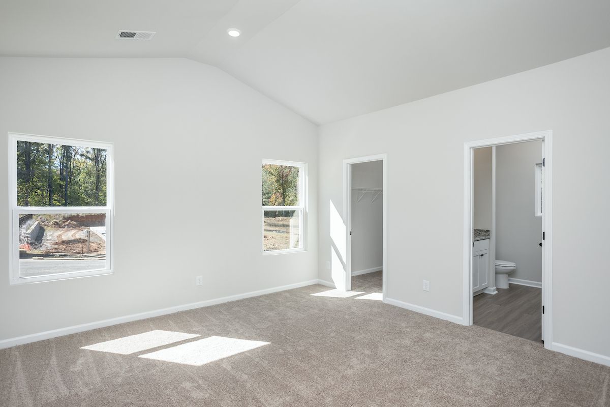The master bedroom has cathedral ceilings