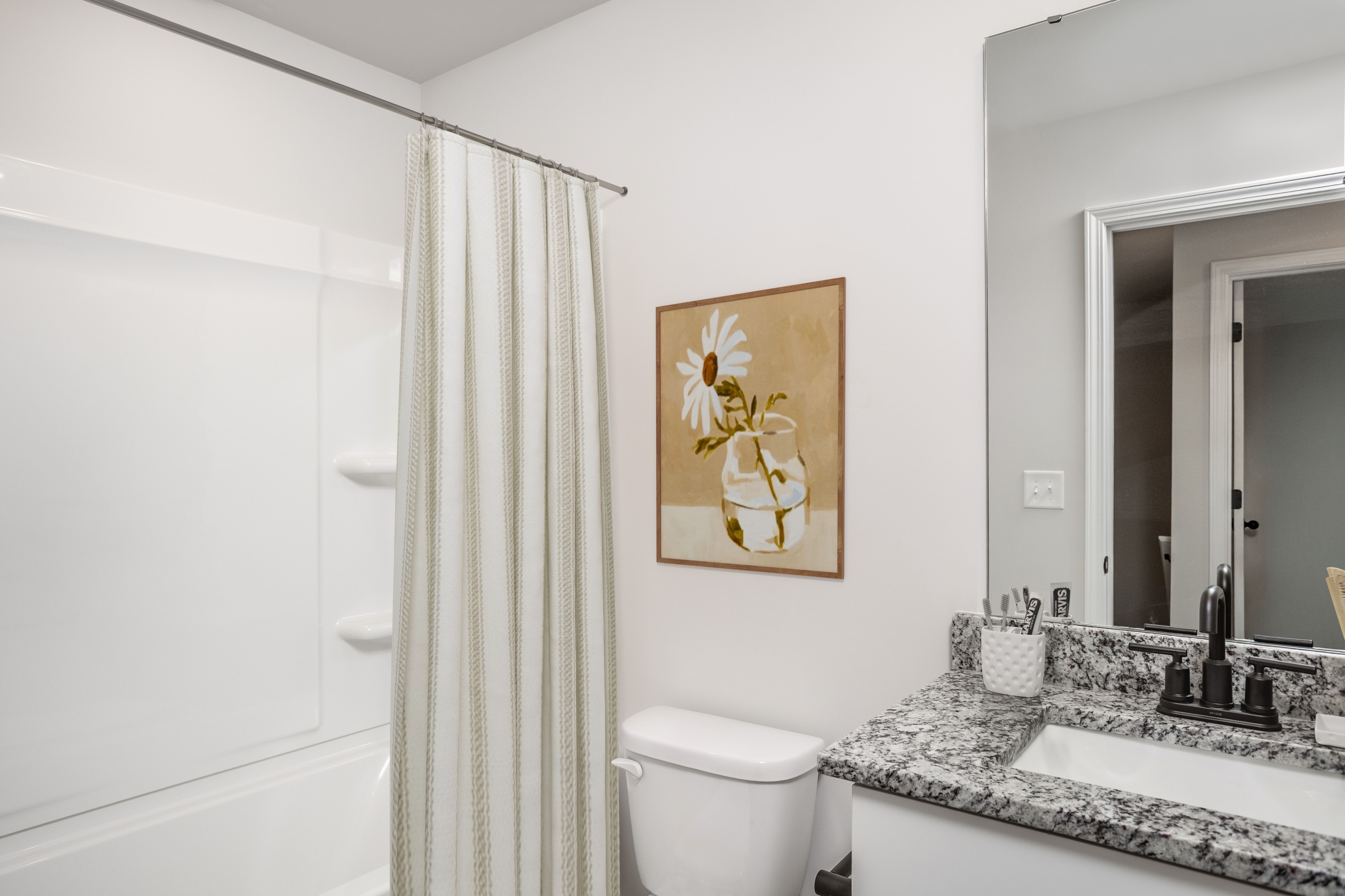 The bathroom has a large soaking tub