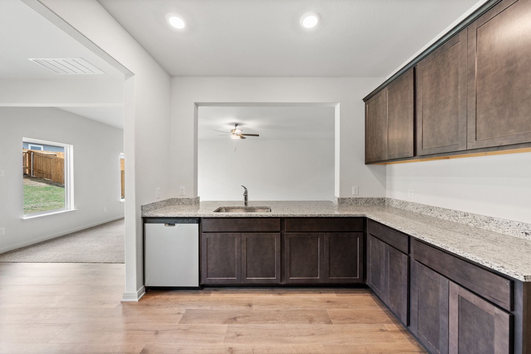 The kitchen has sprawling granite countertops.