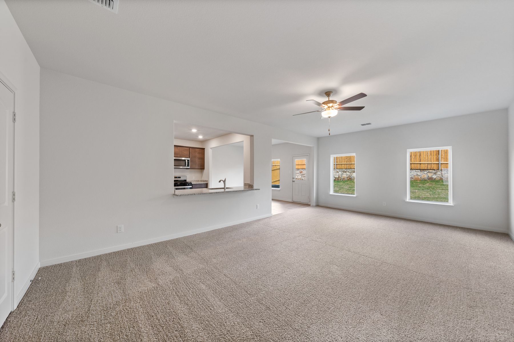 The open layout connects the family room with the kitchen and dining room.