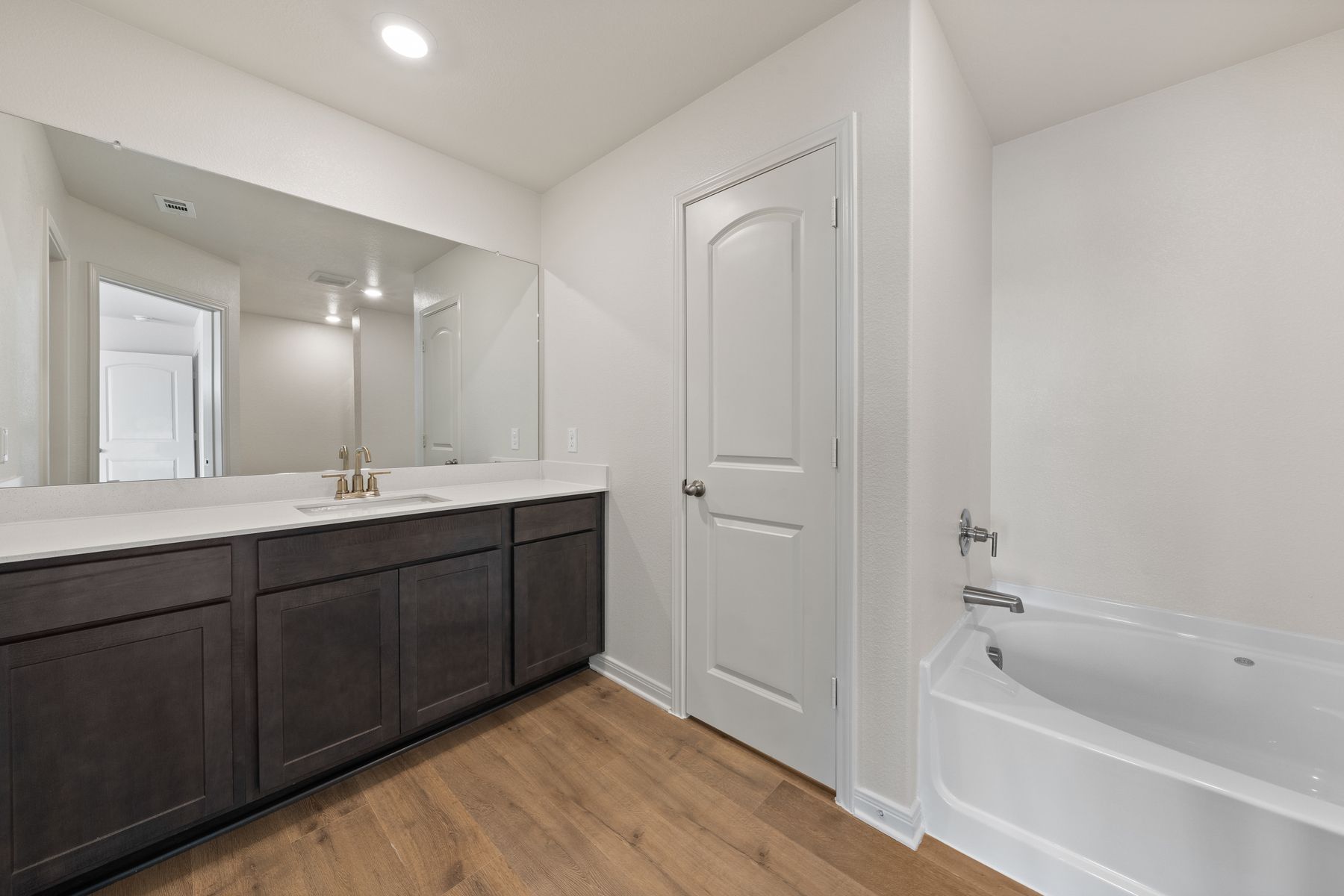 The master bathroom has a large vanity space.