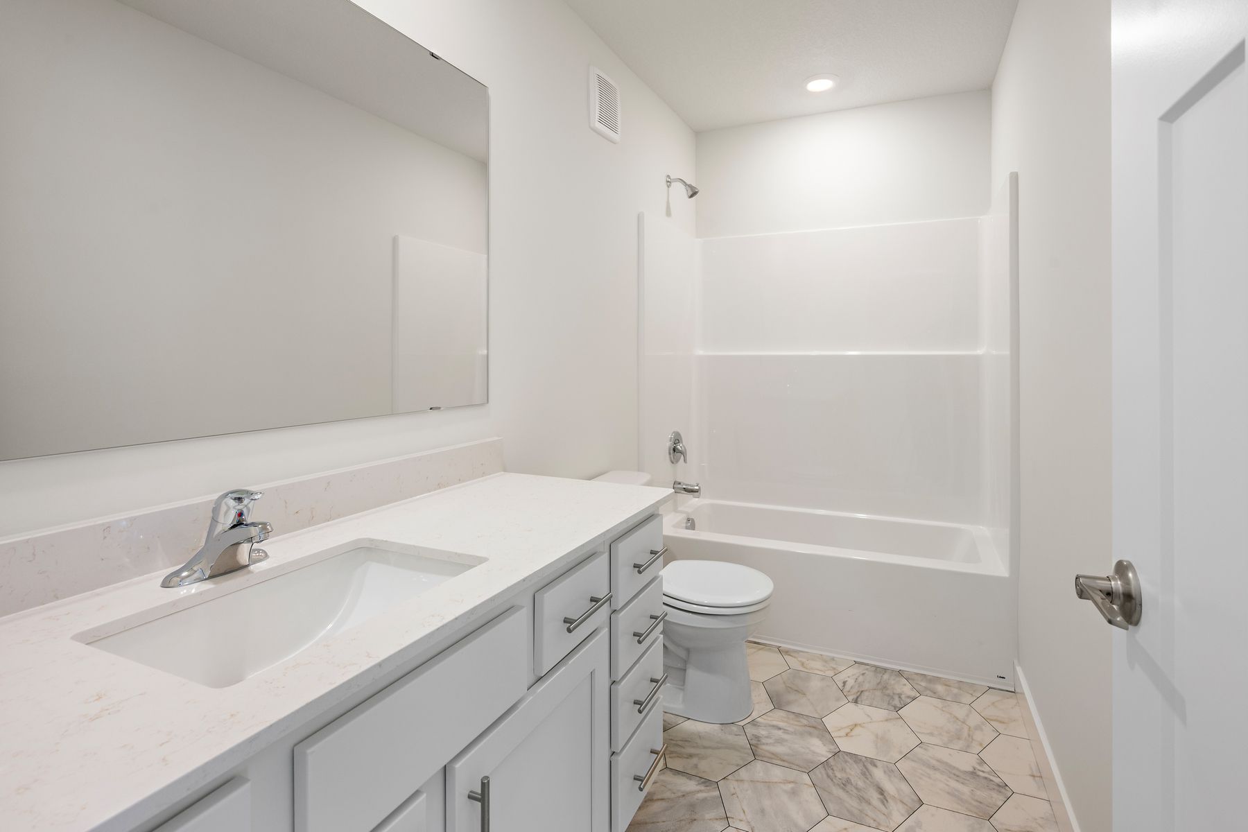 The secondary bathroom has the tub/shower combo.