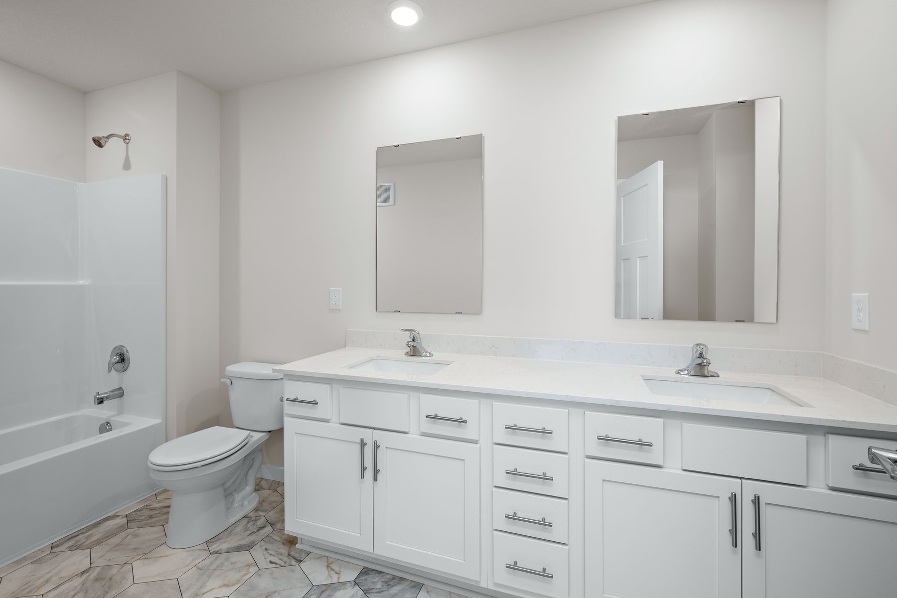 The master bathroom has a dual sink vanity.