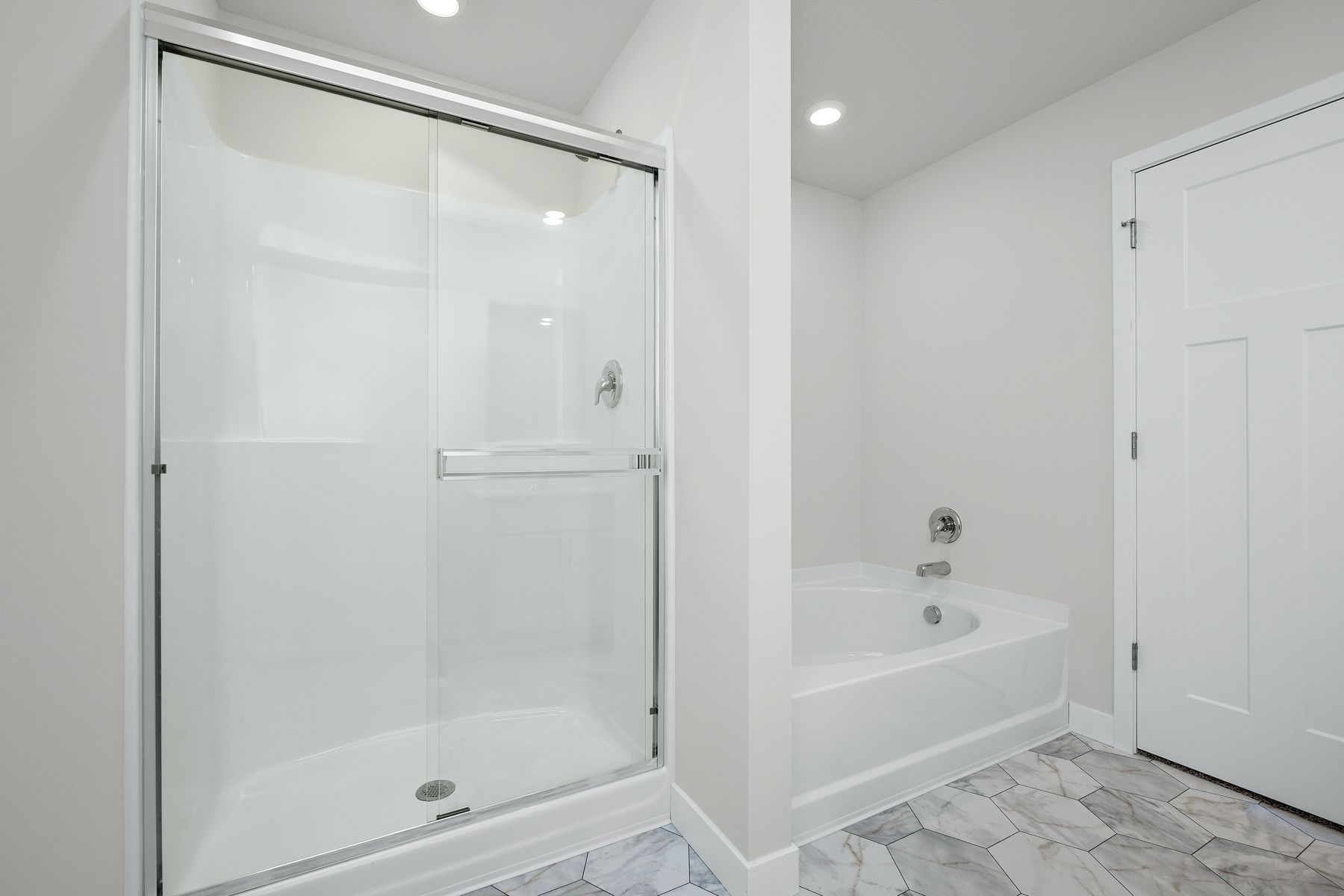 The master bathroom has a step in shower and soaking tub/.
