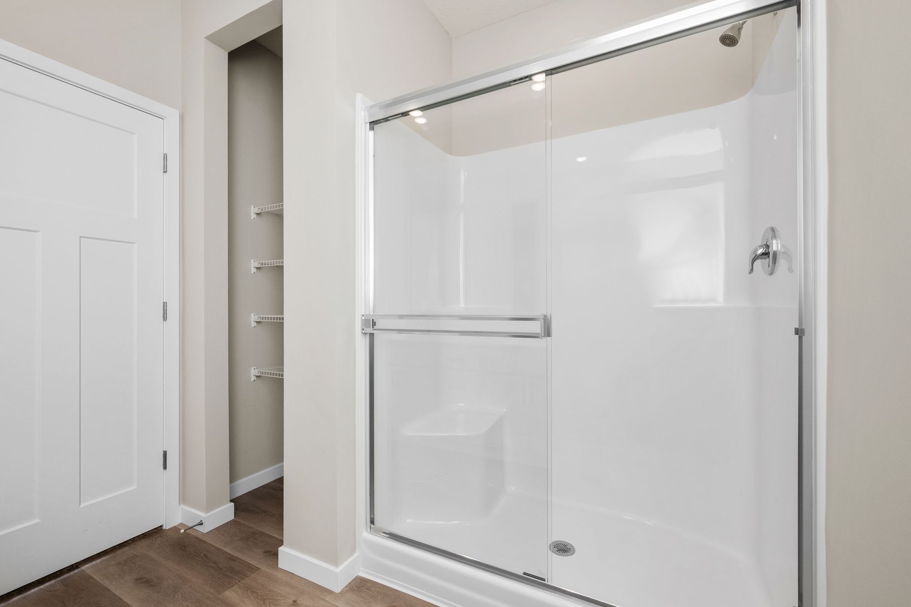The master bathroom has a step in shower and soaking tub