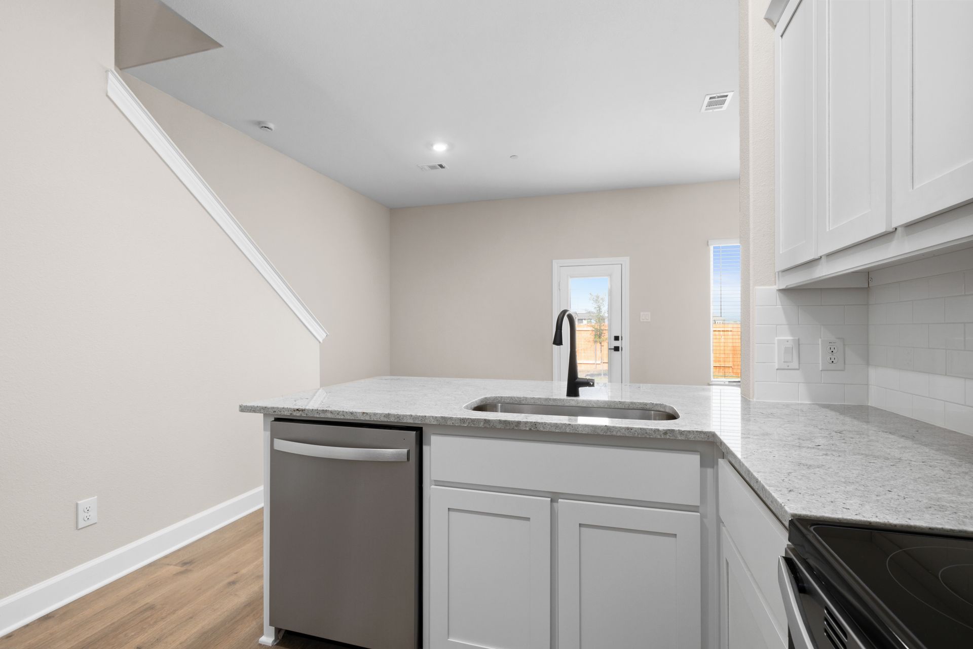 The kitchen looks out to the dining area.