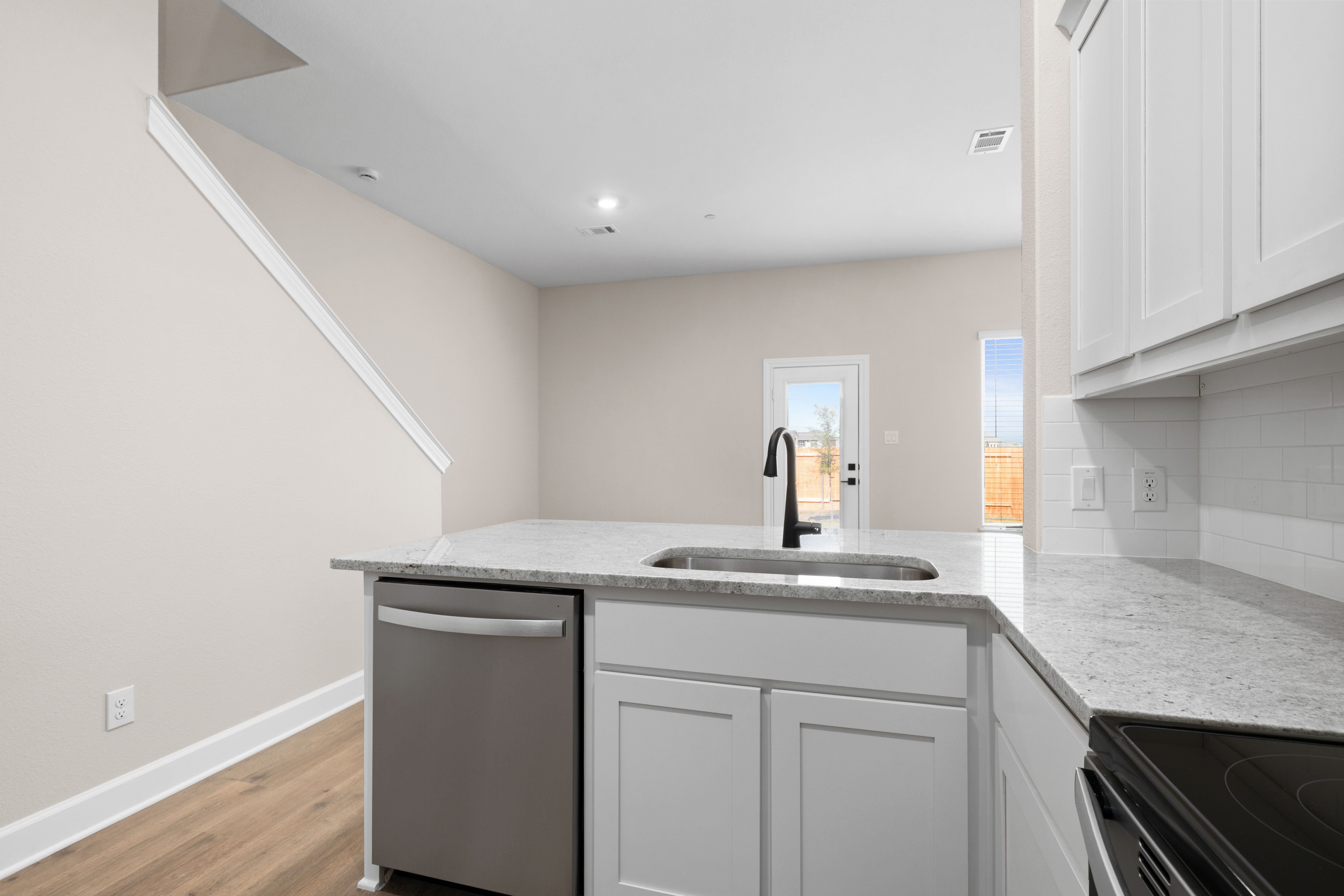 The kitchen looks out to the dining area.