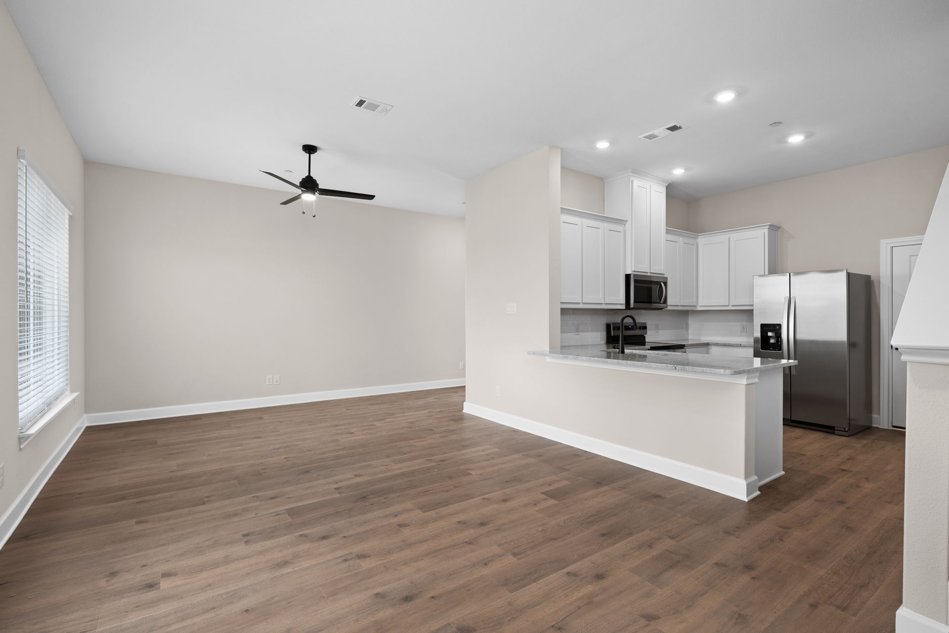 The dining area has large windows that let in great, natural light.