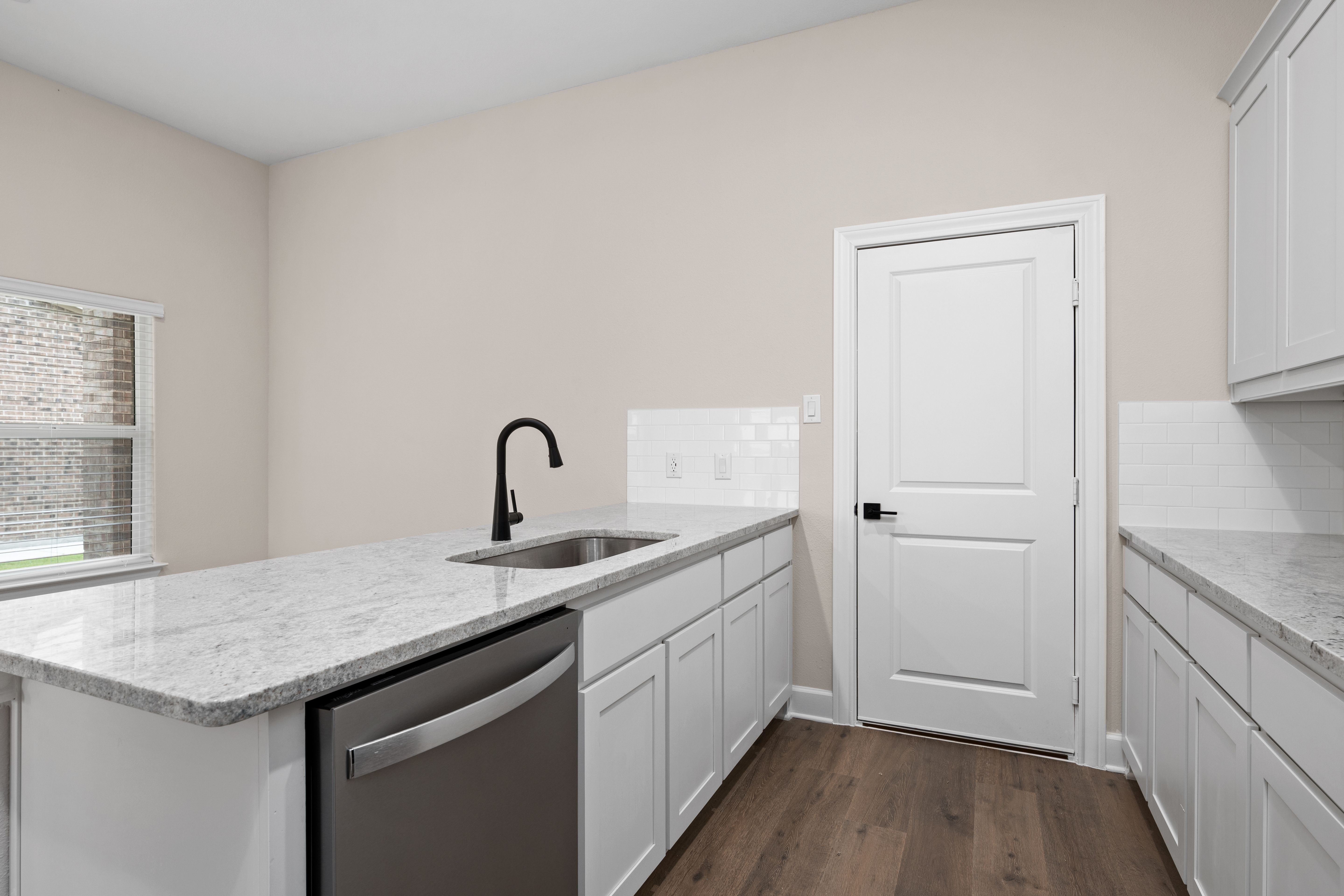 The kitchen looks out to the dining area.