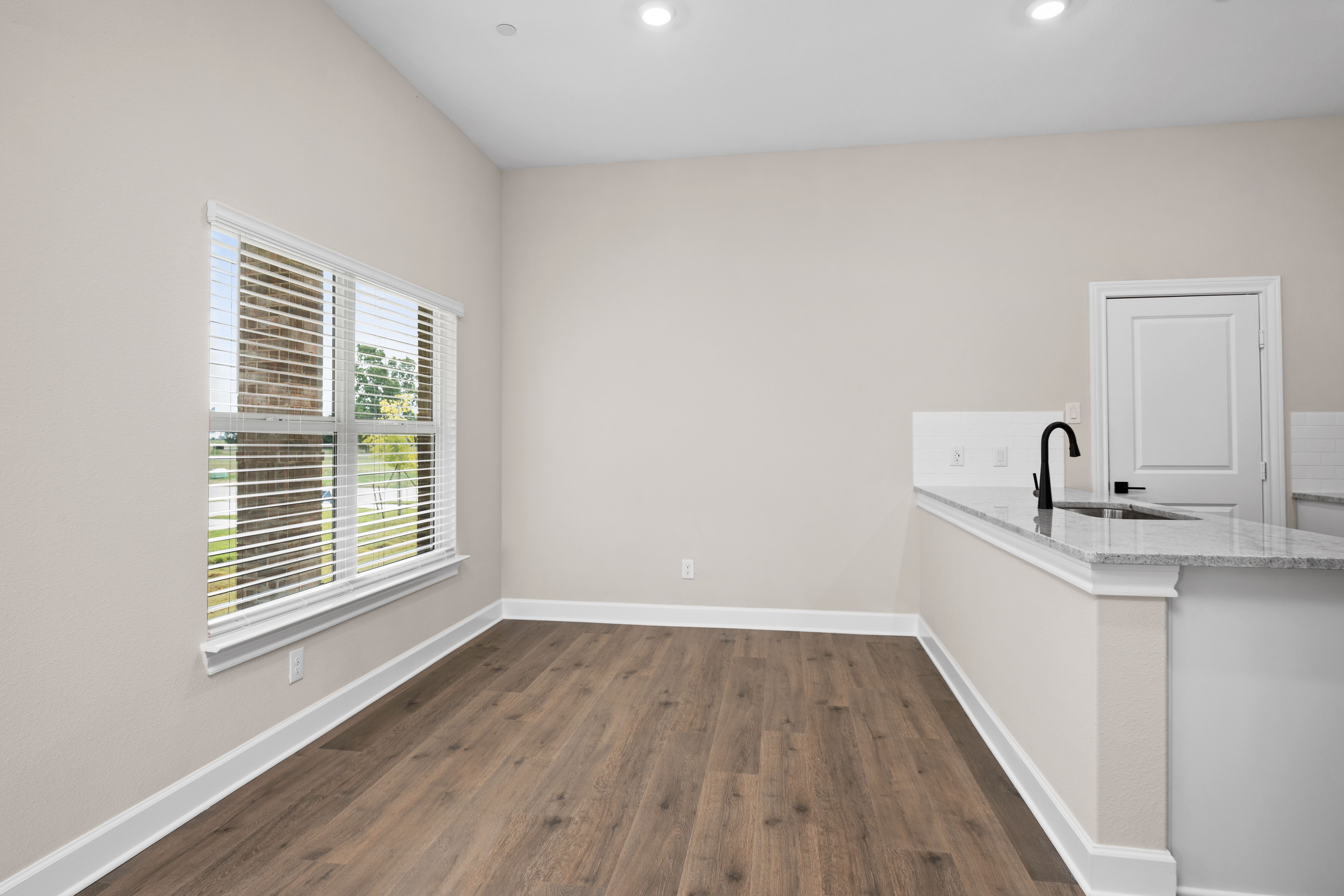 The dining area has large windows that let in great, natural light.