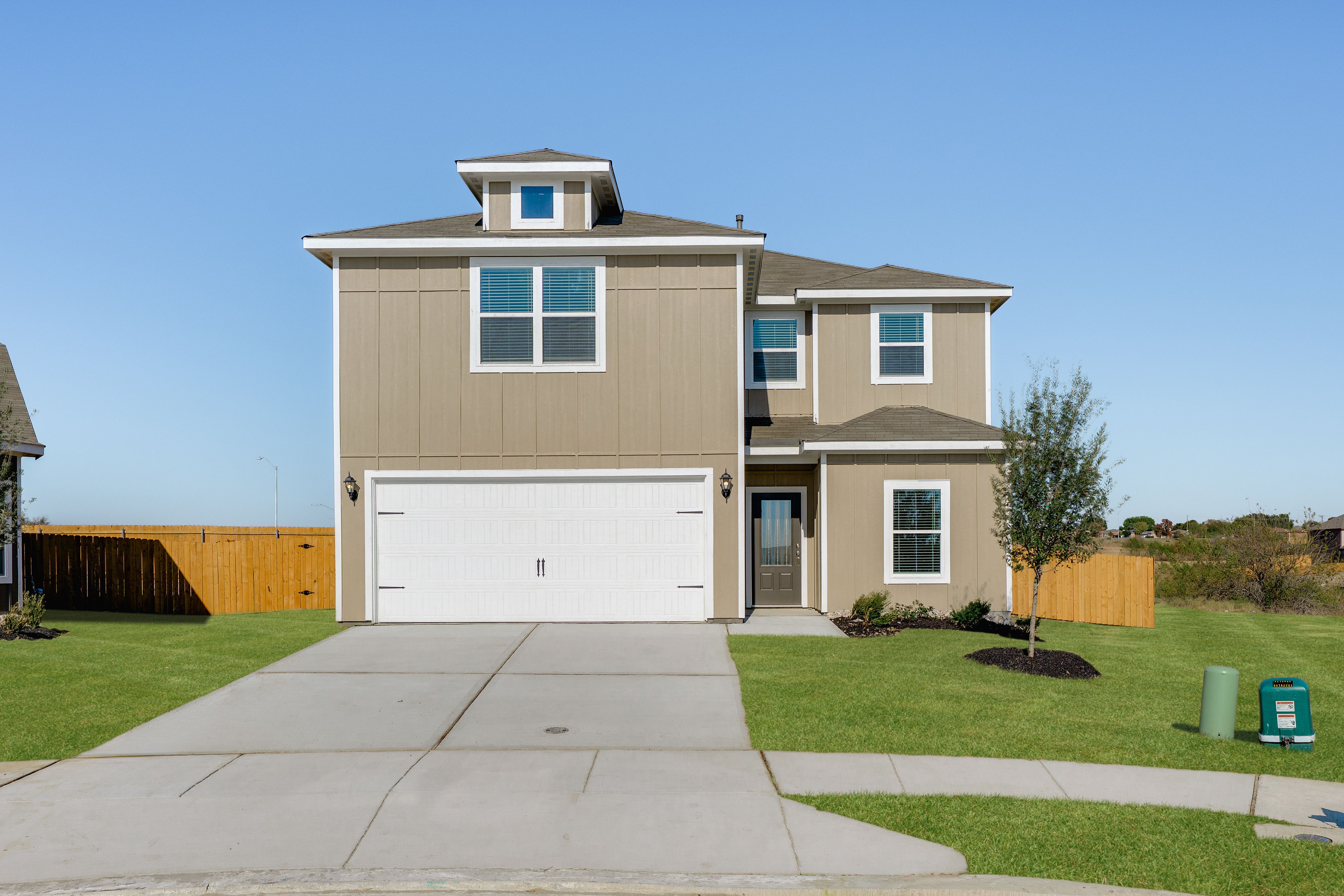 The two-story Driftwood plan is a beautiful siding home.