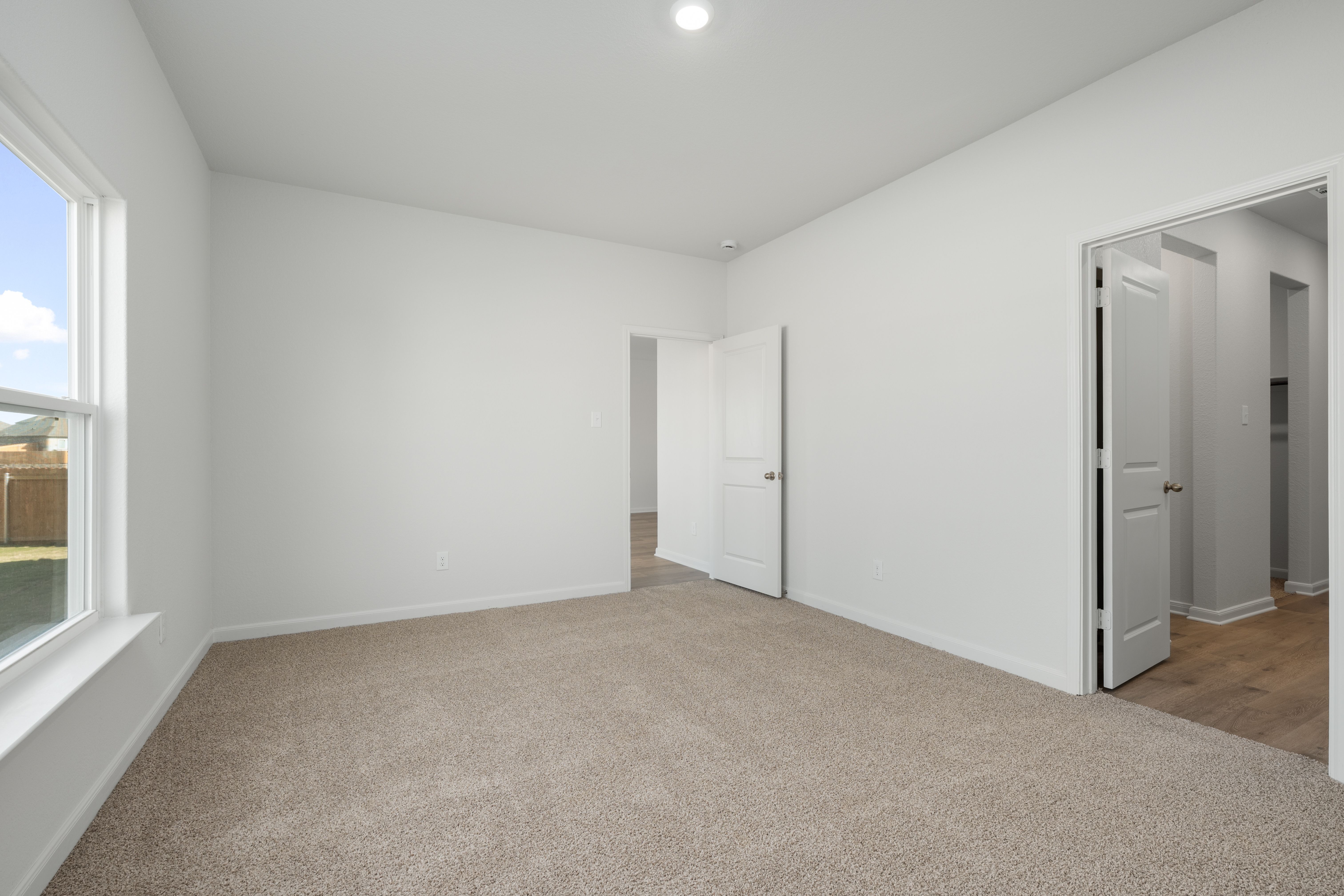 The master suite has a large bedroom, ensuite bathroom and walk-in closet.