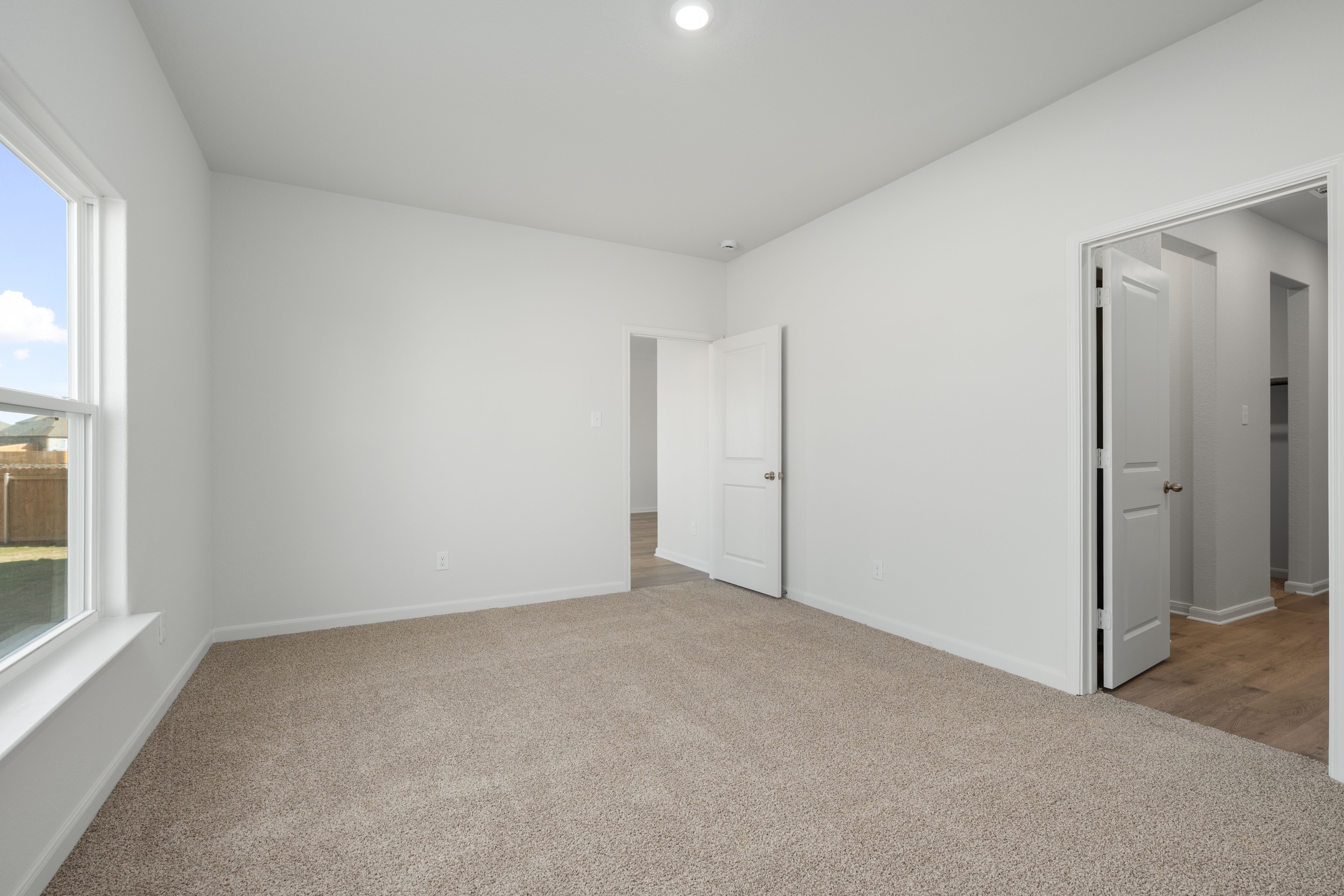 The master suite has a large bedroom, ensuite bathroom and walk-in closet.