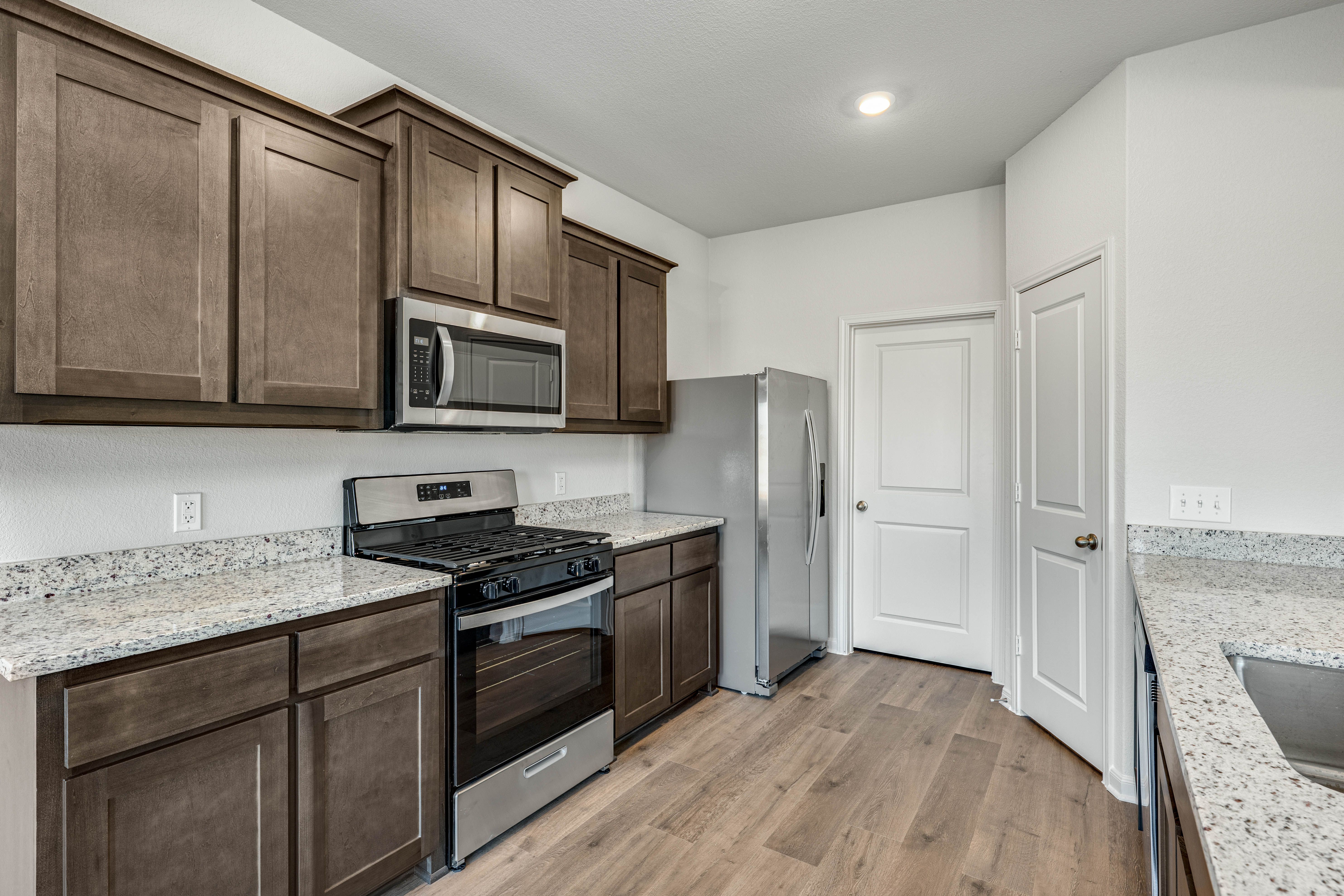 The kitchen has beautiful granite countertops.