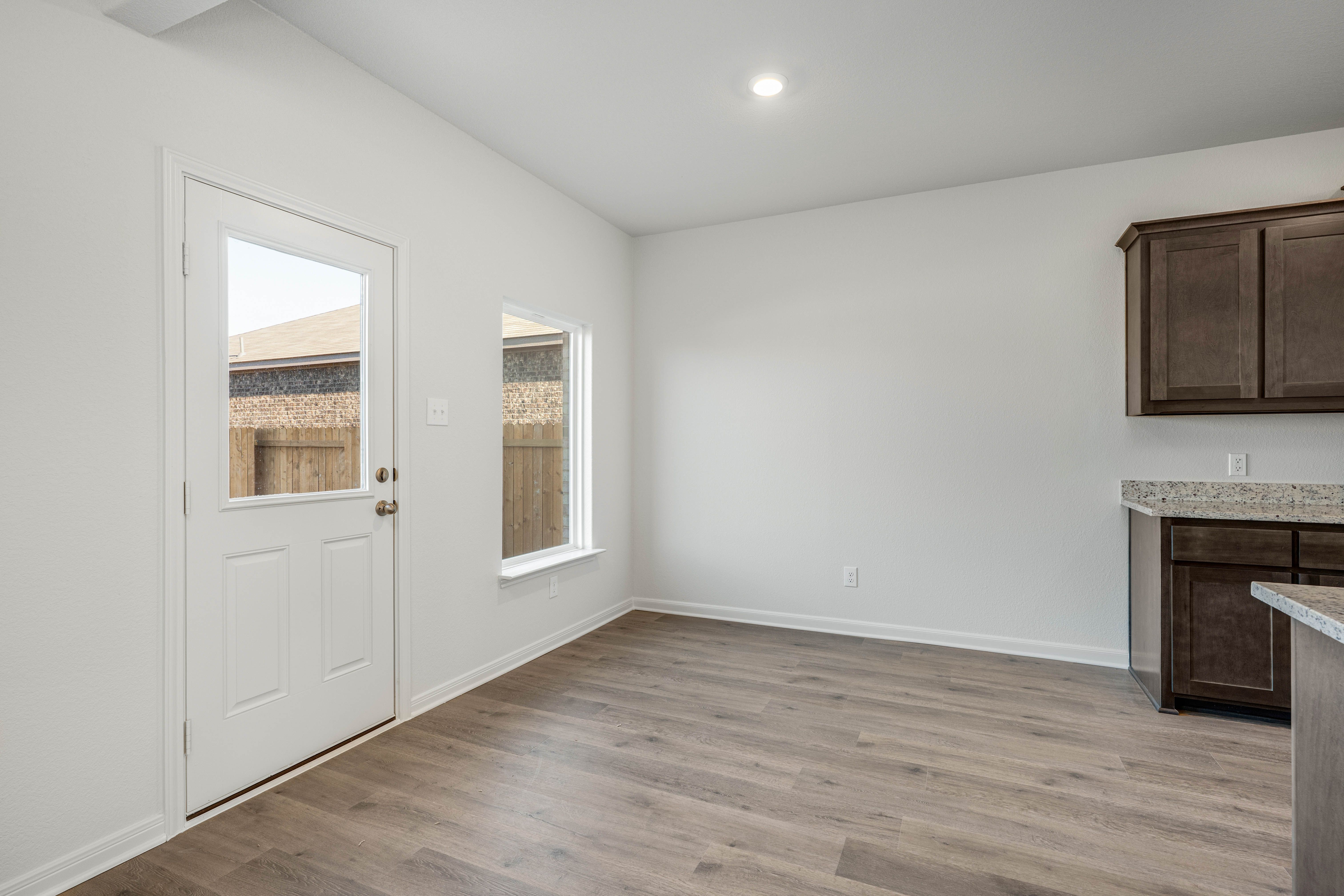 The dining room has a large window that lets in great, natural light.