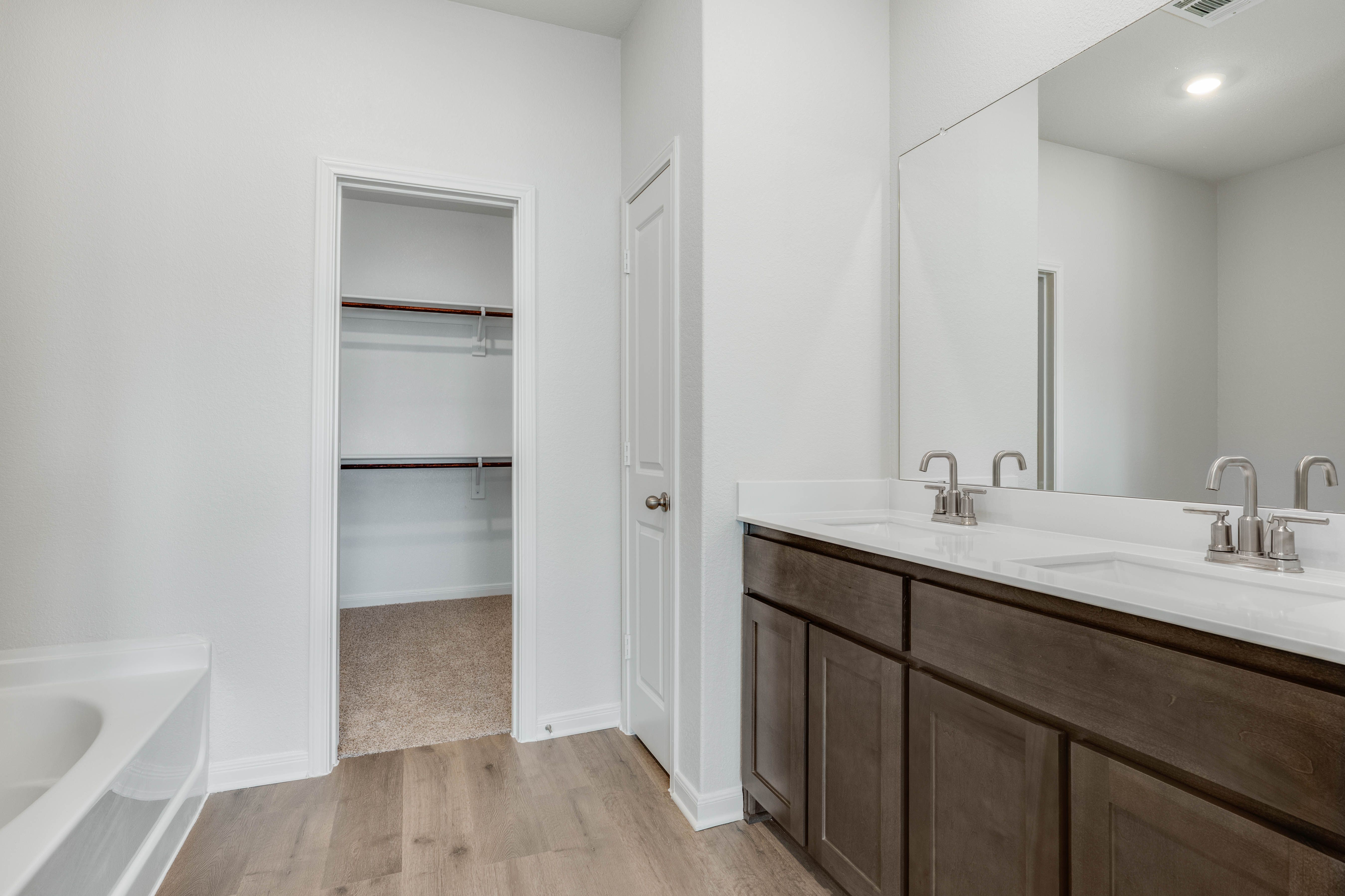The master bathroom has a nice vanity space.