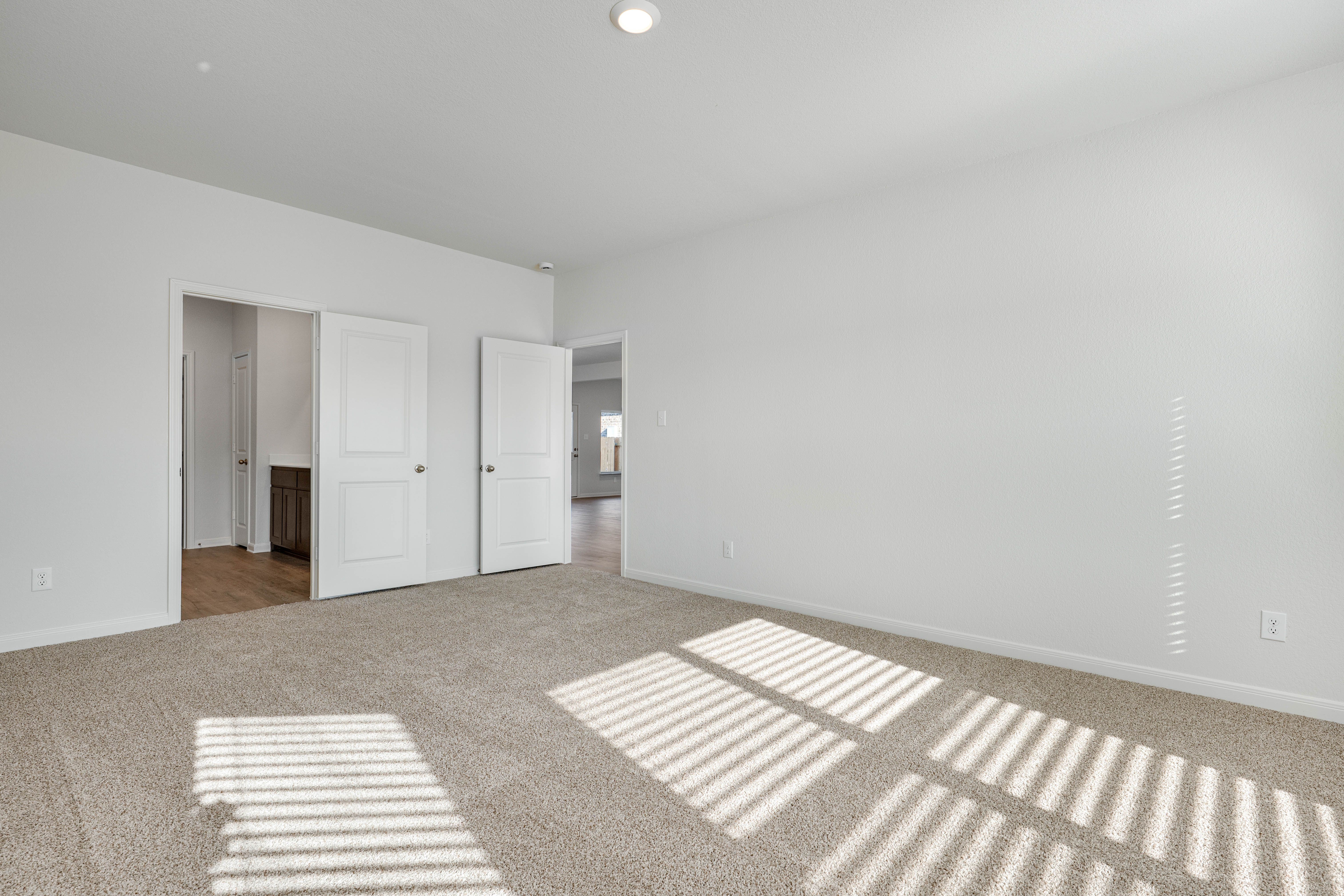 The master suite has a large bedroom, ensuite bathroom and walk-in closet.
