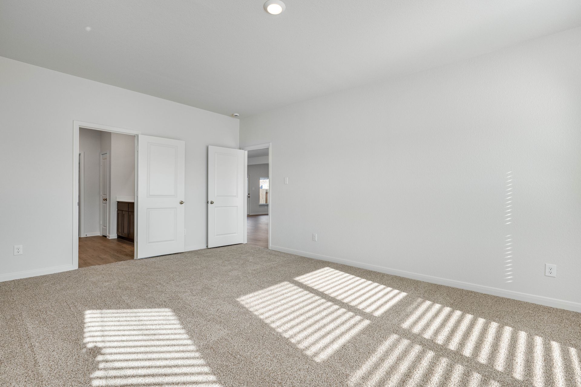 The master suite has a large bedroom, ensuite bathroom and walk-in closet.