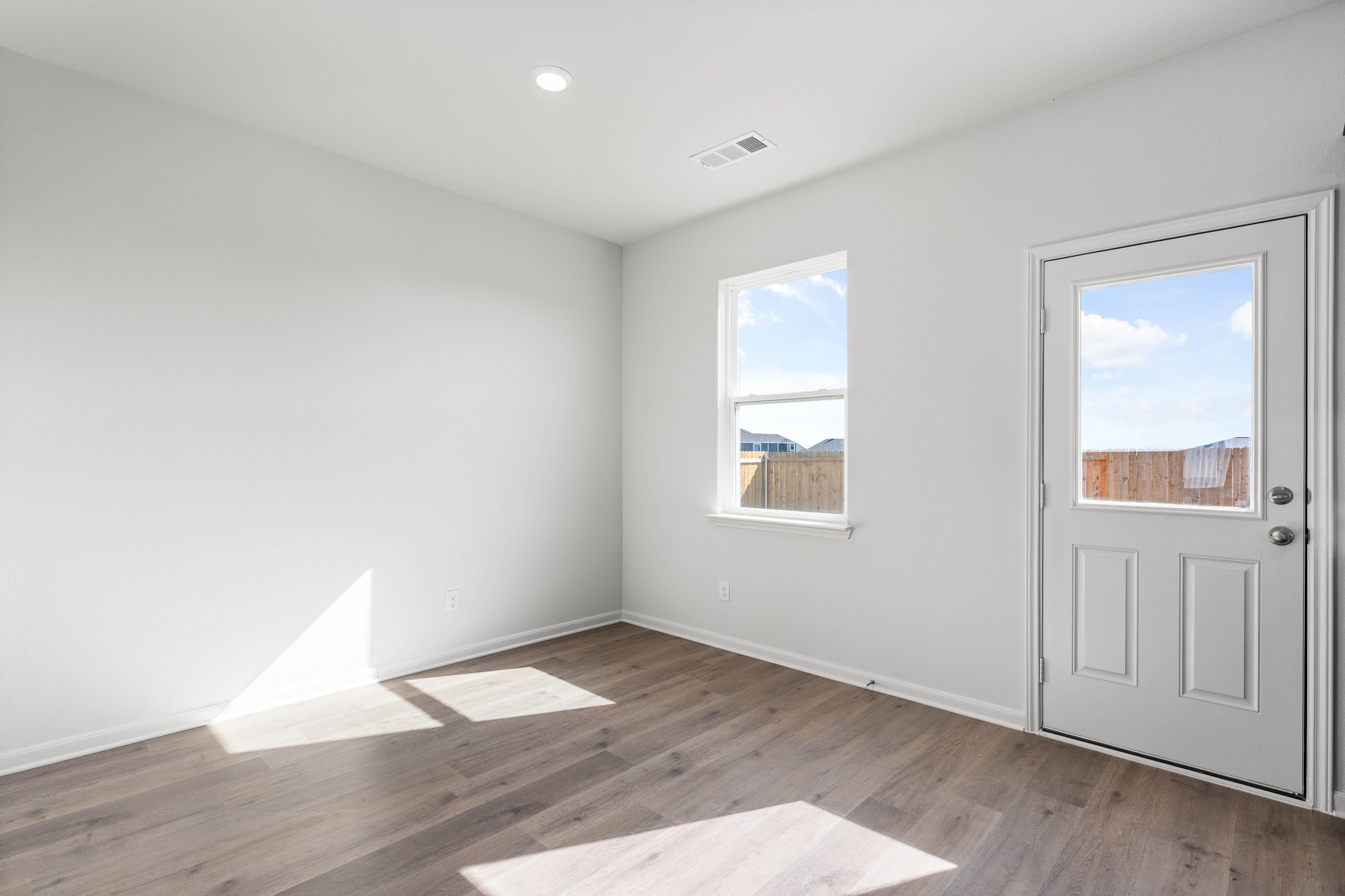 The dining room has a large window that lets in great, natural light.
