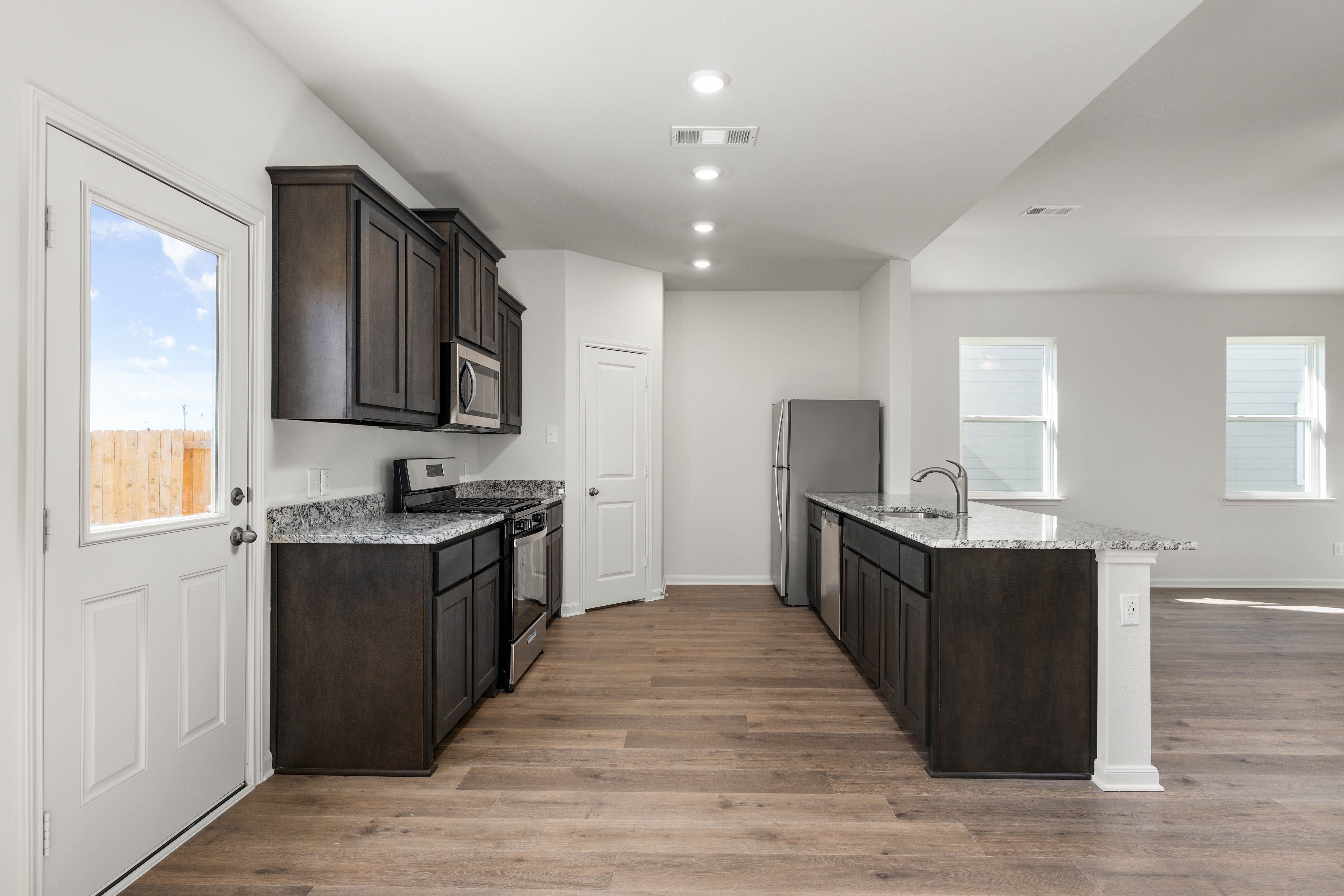The kitchen of the Reed has sprawling granite countertops.