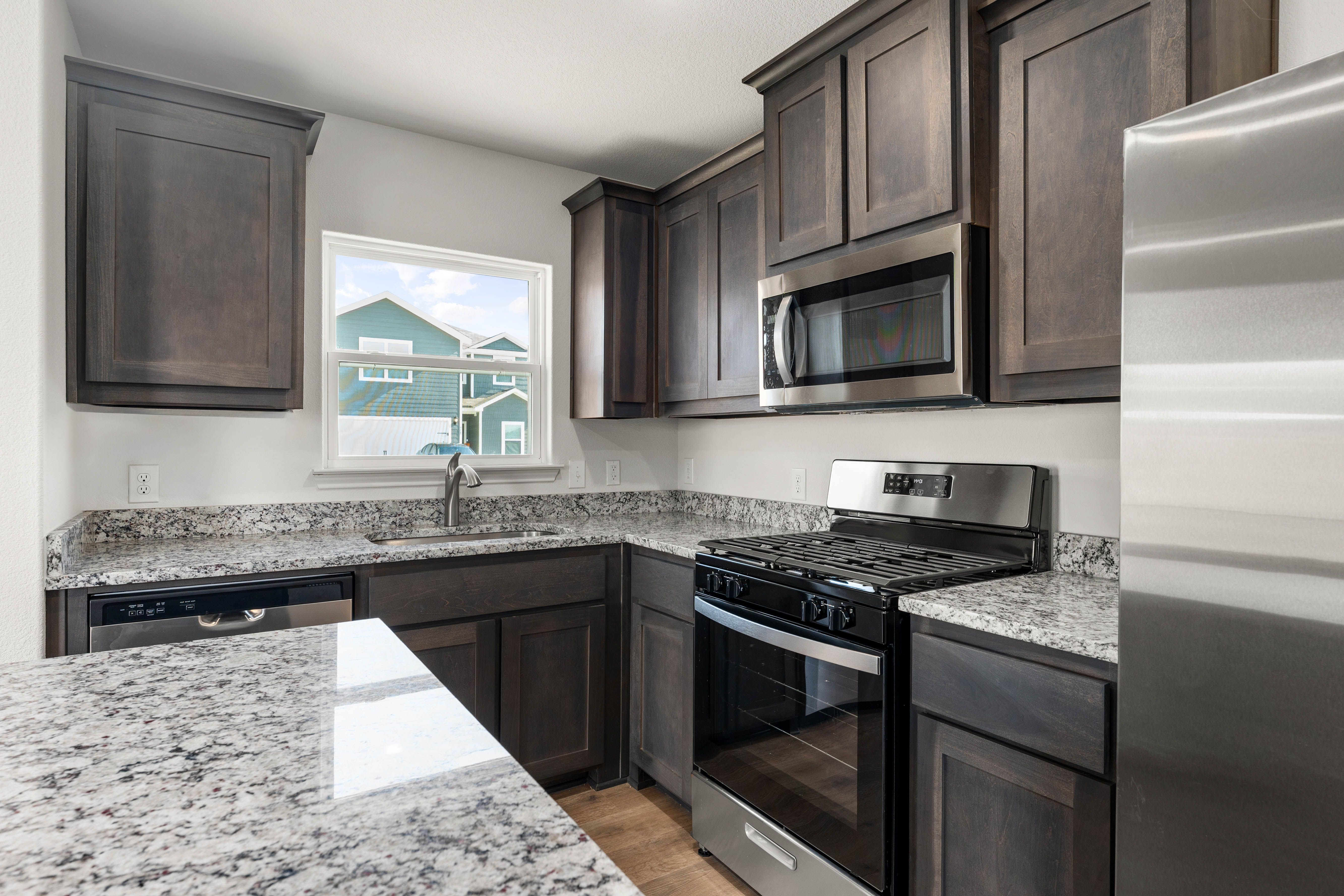 The kitchen of the Sabine has sprawling granite countertops.