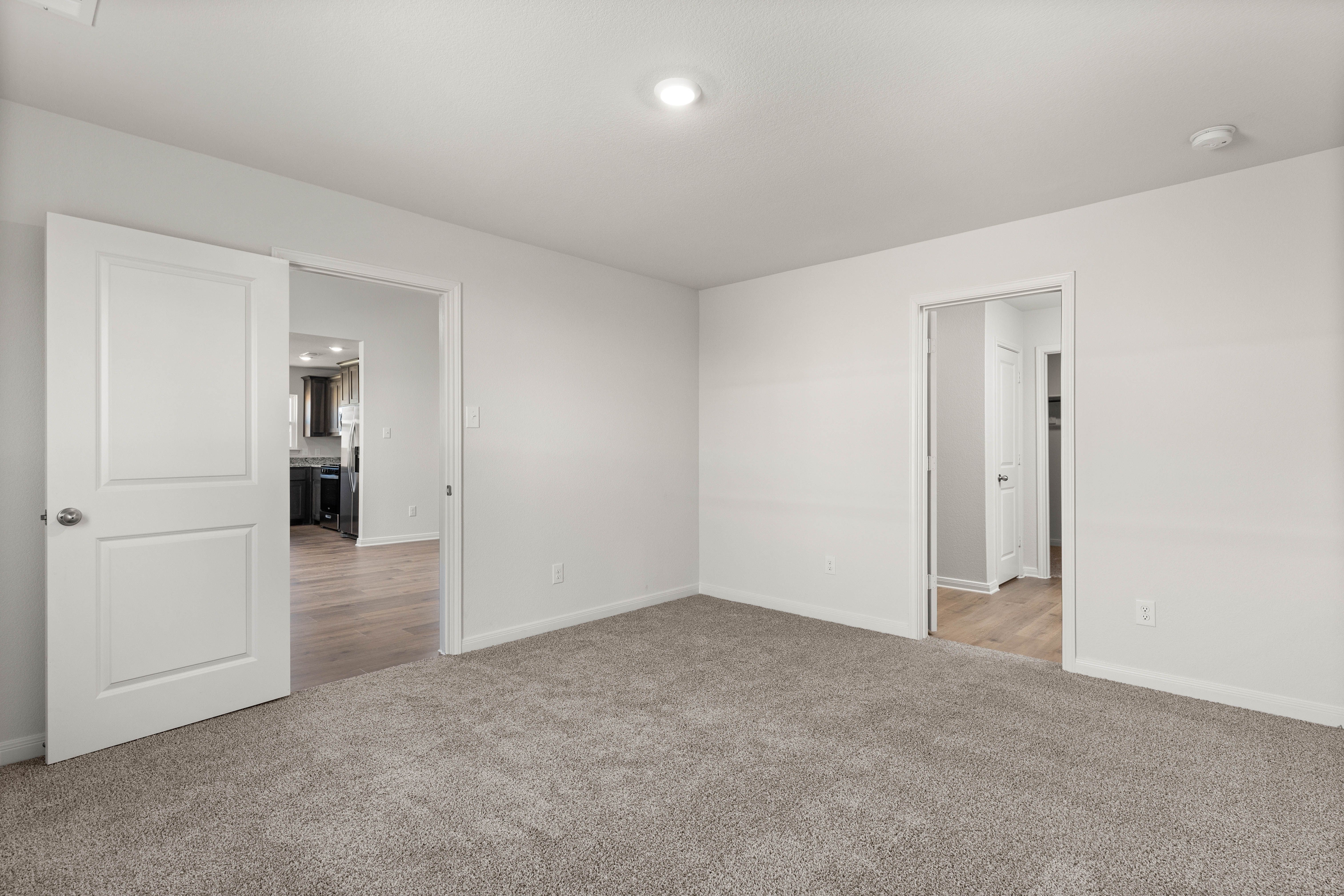 The master suite has a large bedroom, ensuite bathroom and walk-in closet.