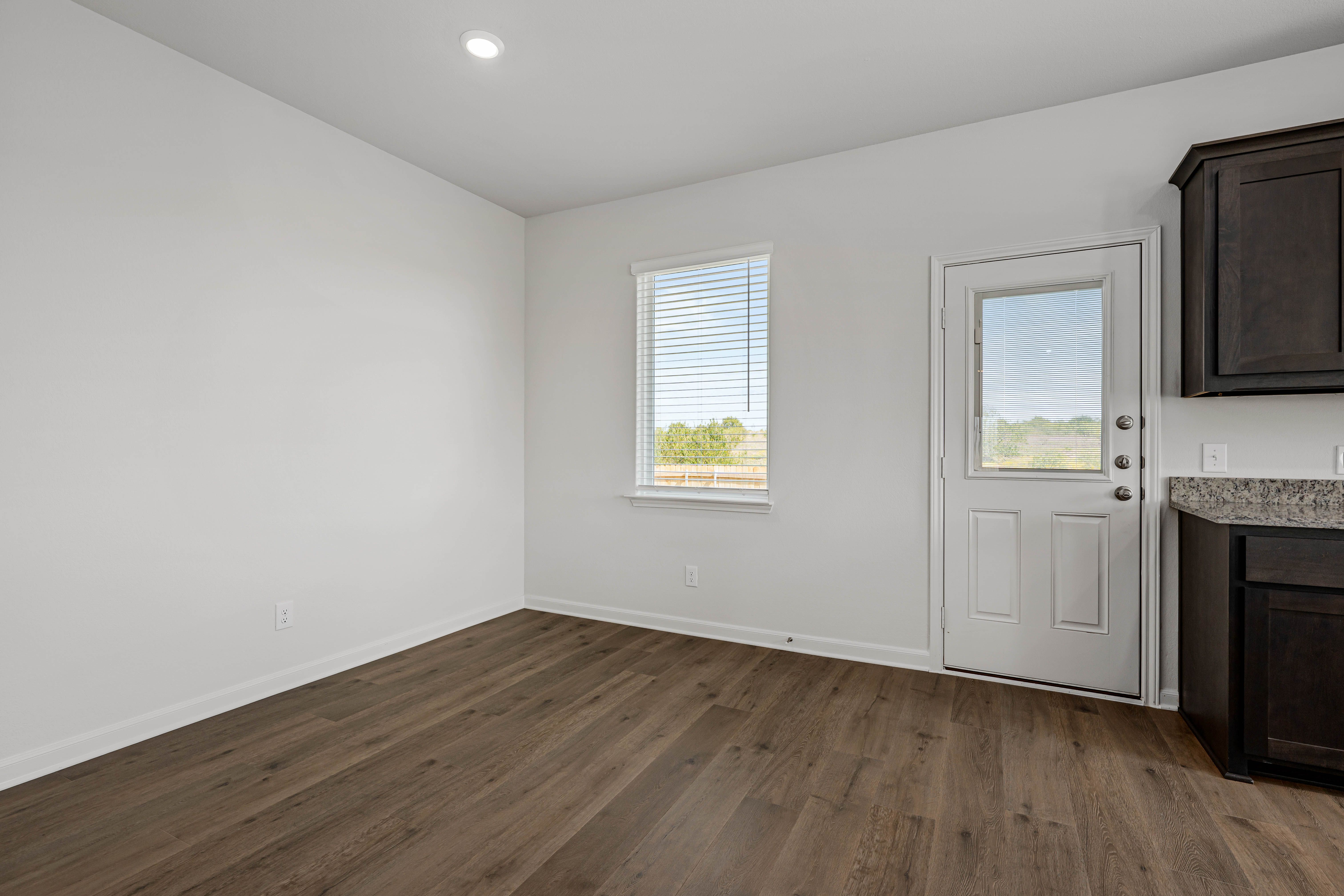 The dining room sits right off of the kitchen.