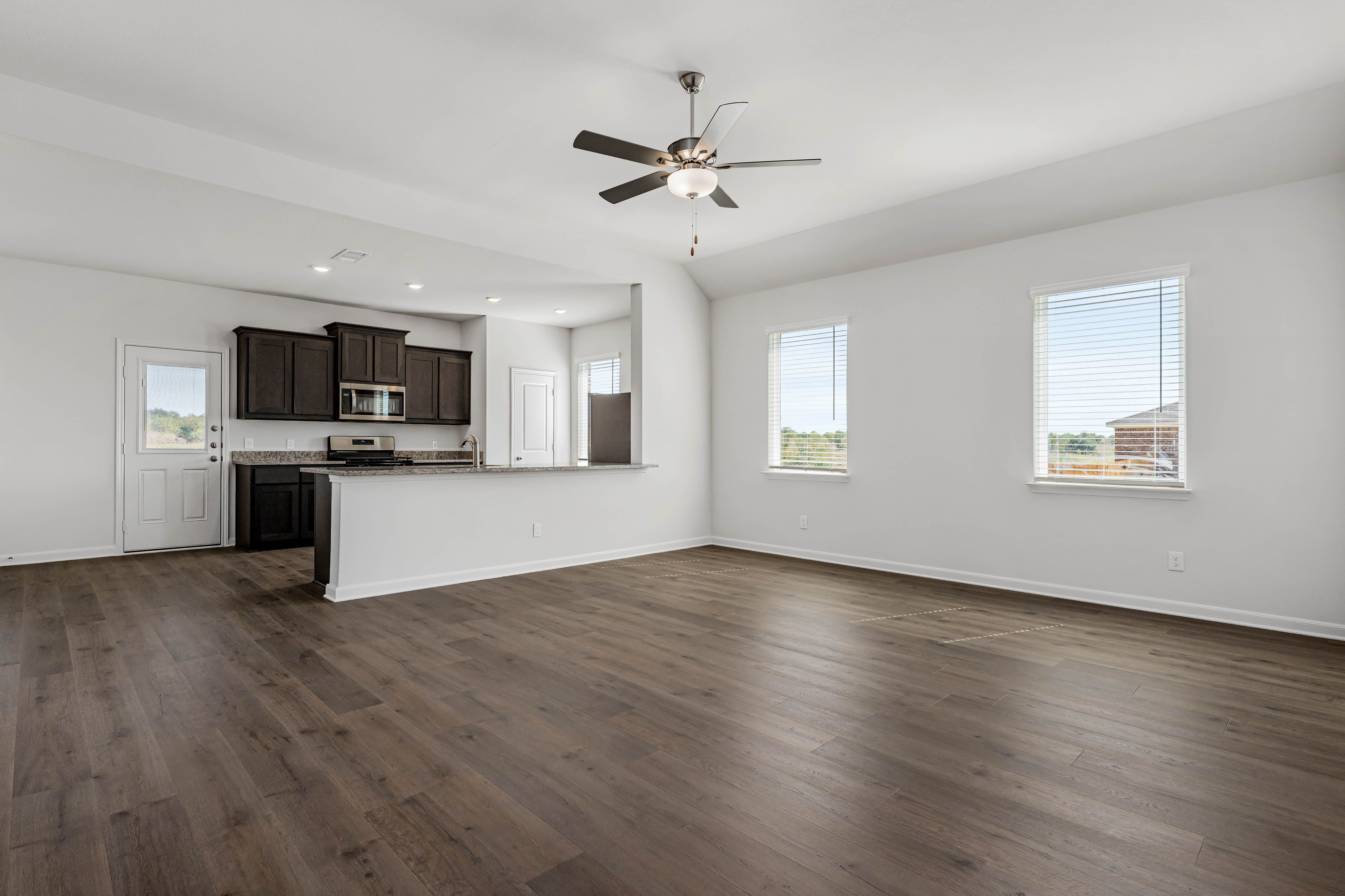 This open-concept layout connects the kitchen, dining room and family room.