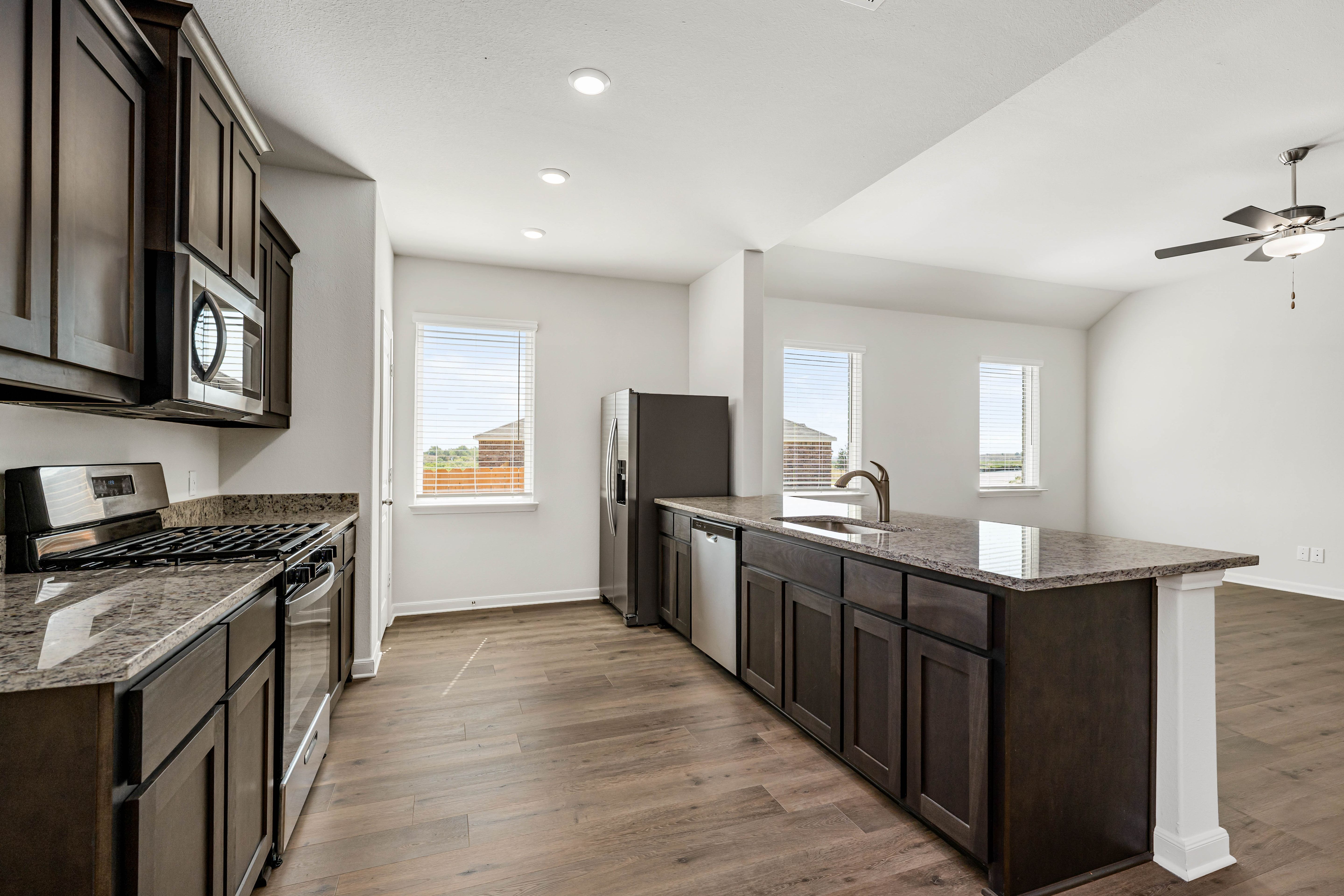 The kitchen has beautiful wood cabinetry.