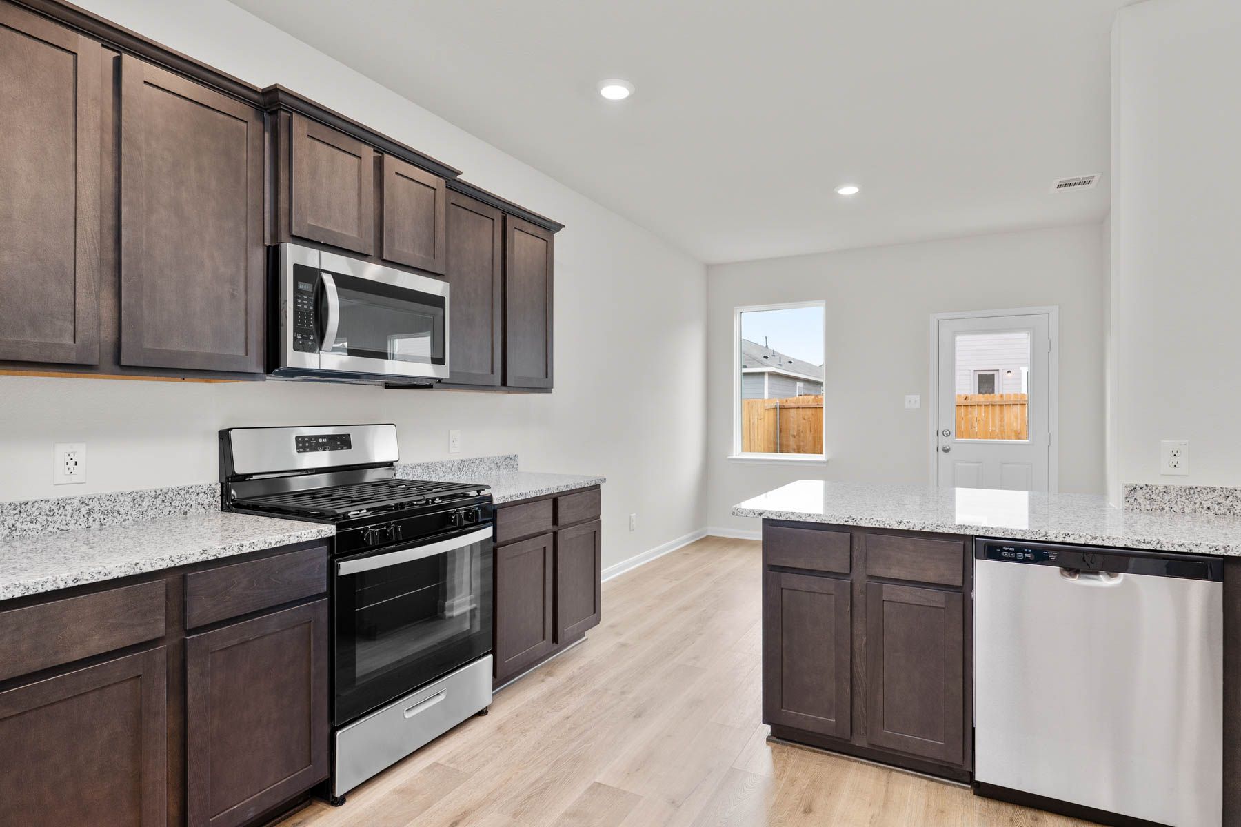 The kitchen has energy-efficient, stainless-steel appliances.