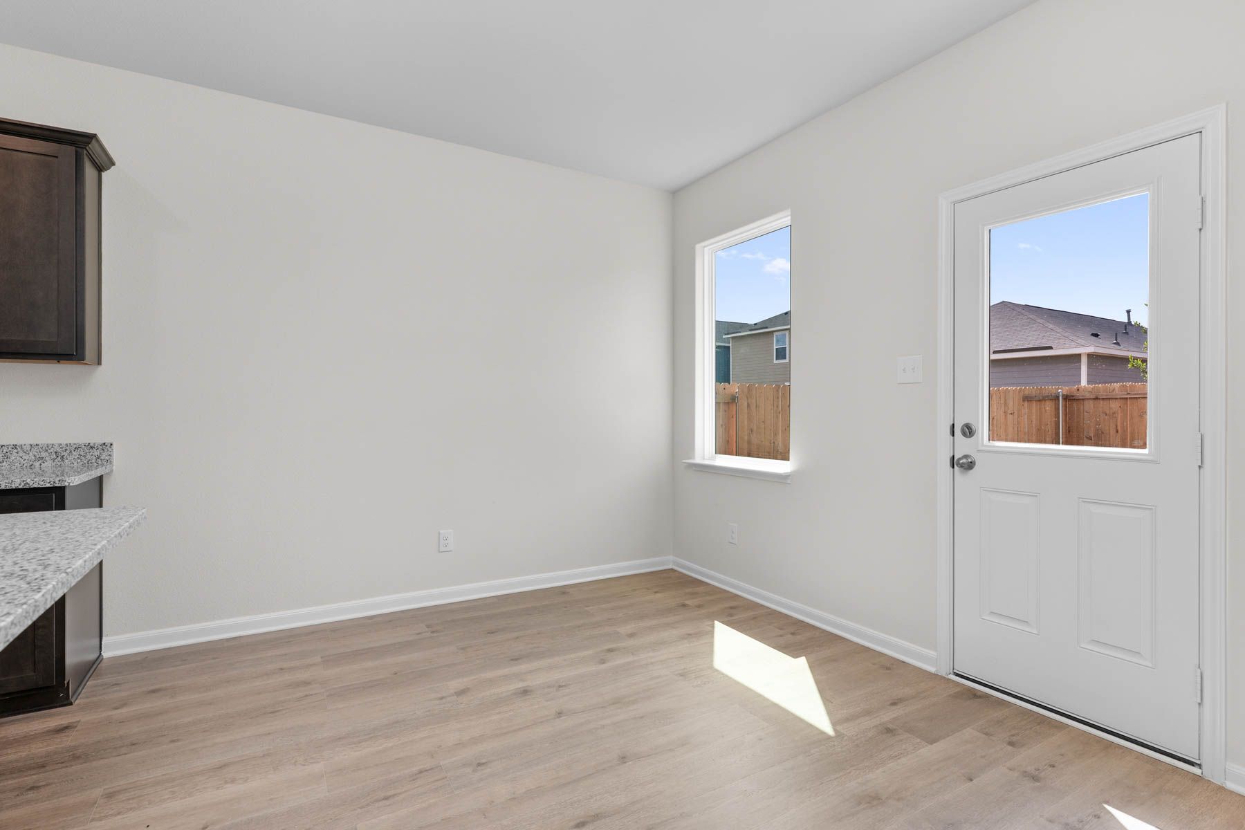 The dining room has a large window that lets in great, natural light and backyard views.