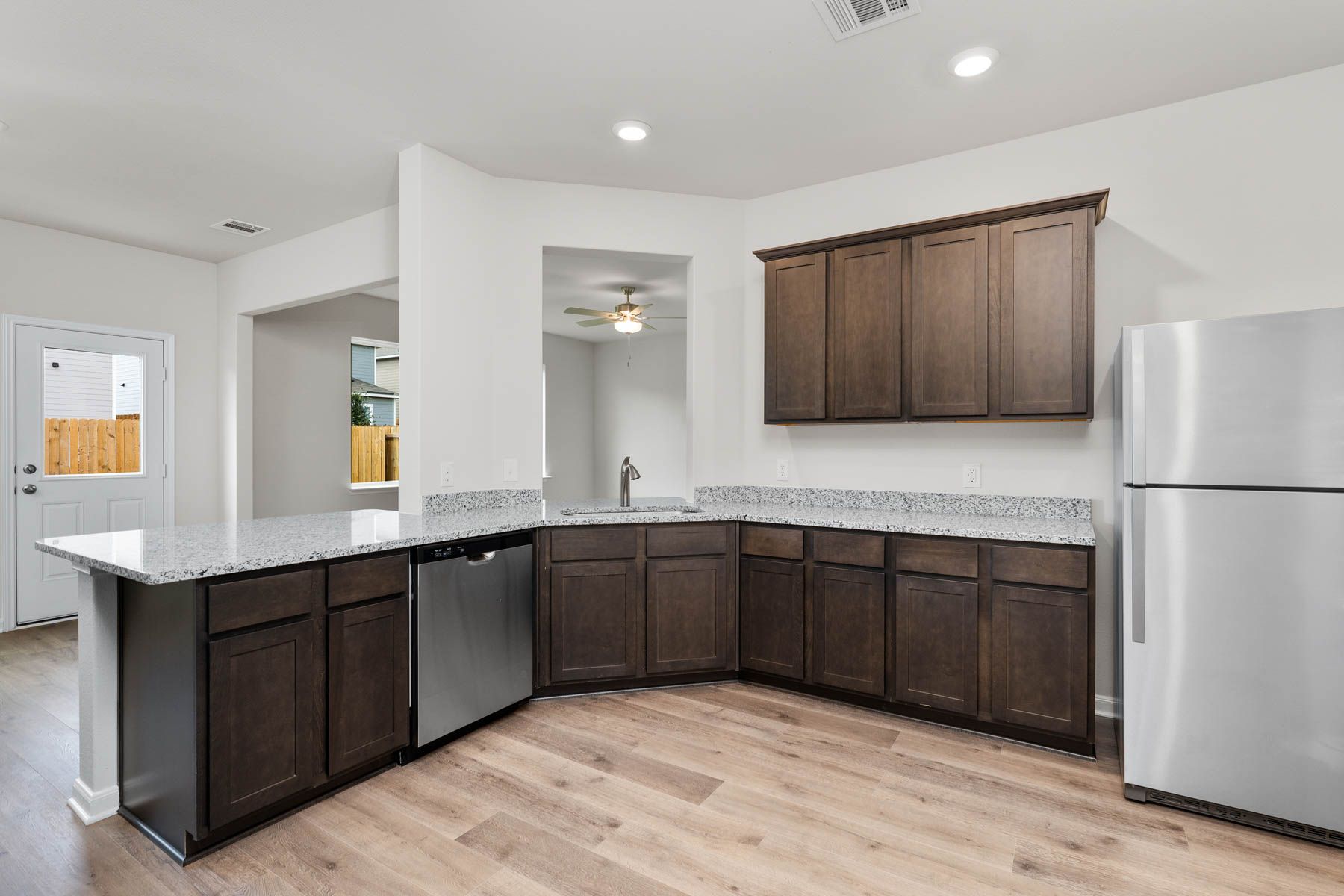 The kitchen has a Moen faucet with a pullout nozzle.