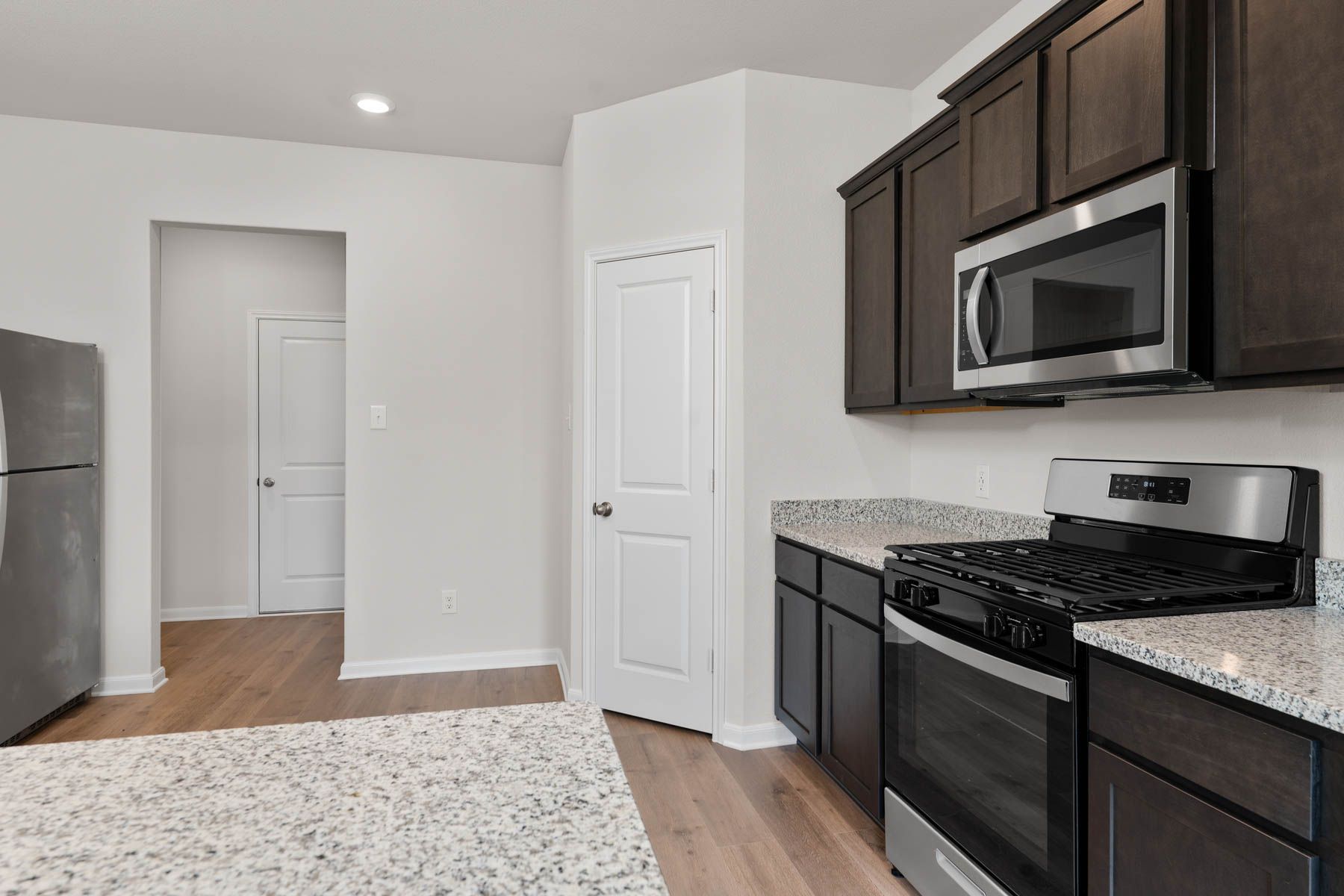 The kitchen has a large pantry that is a great place to store food and other kitchen essentials.