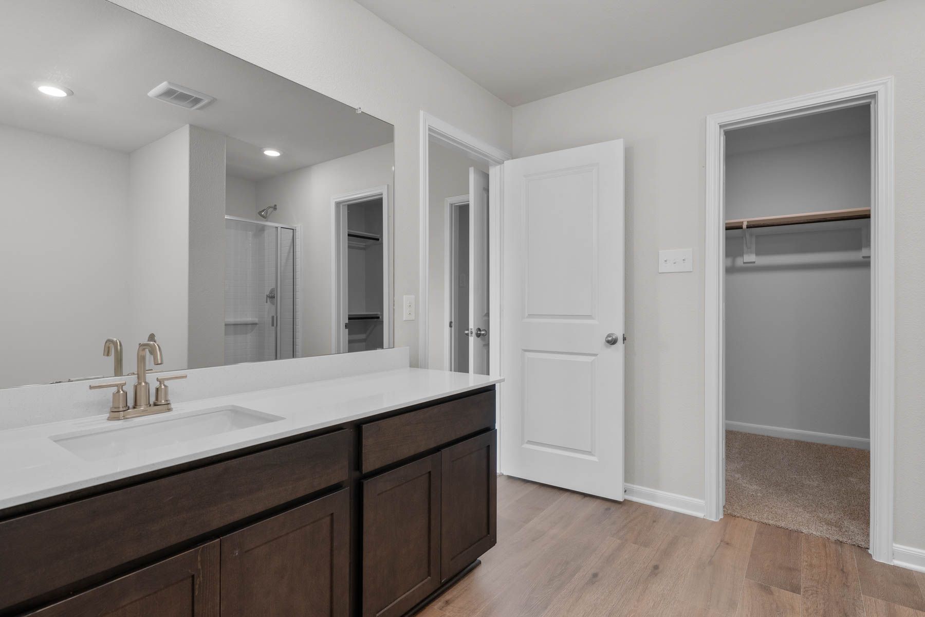The master bathroom has a sprawling vanity space.