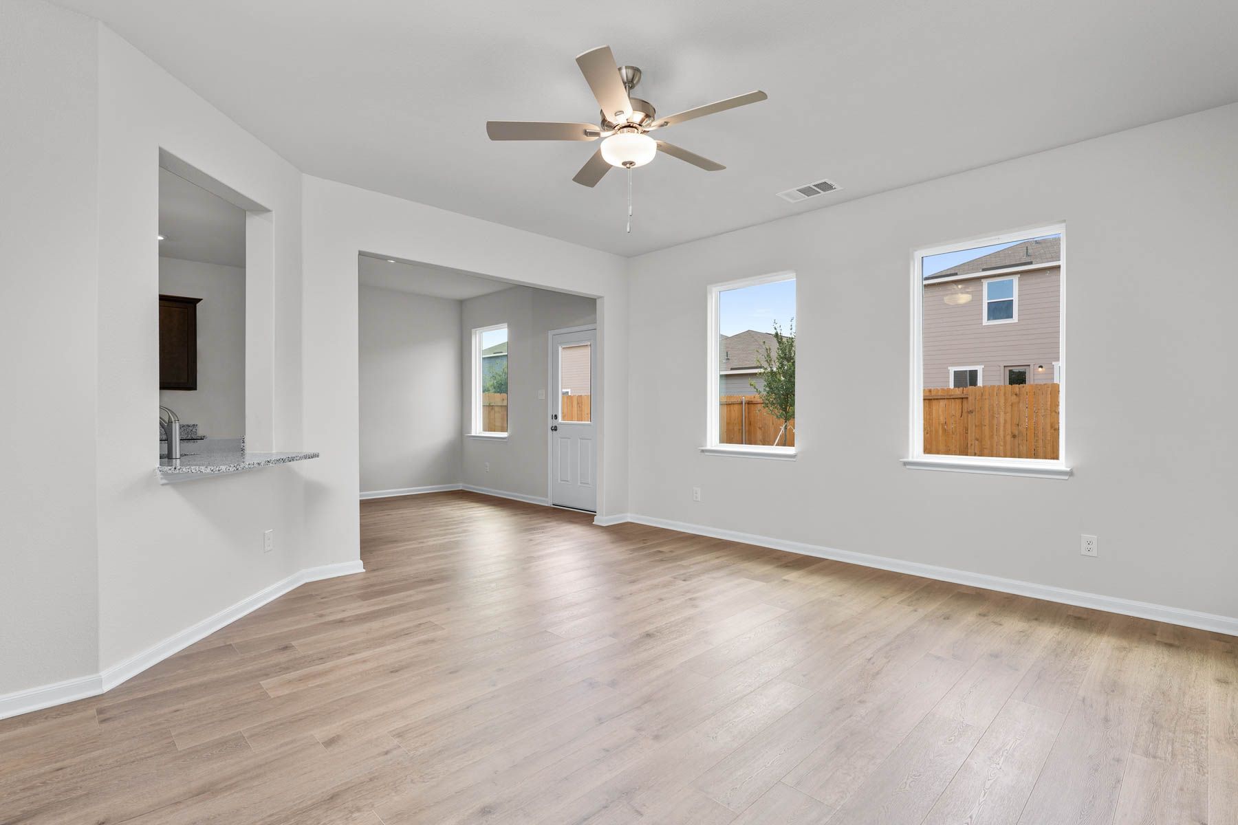 The living room has two large windows that let in great, natural light and backyard views.
