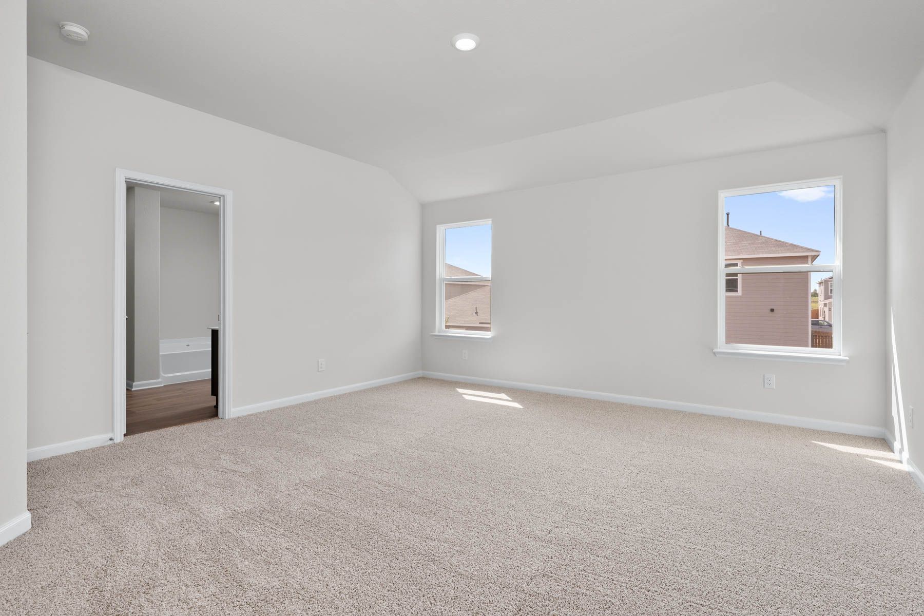 The master bedroom has two large windows that in great, natural light.