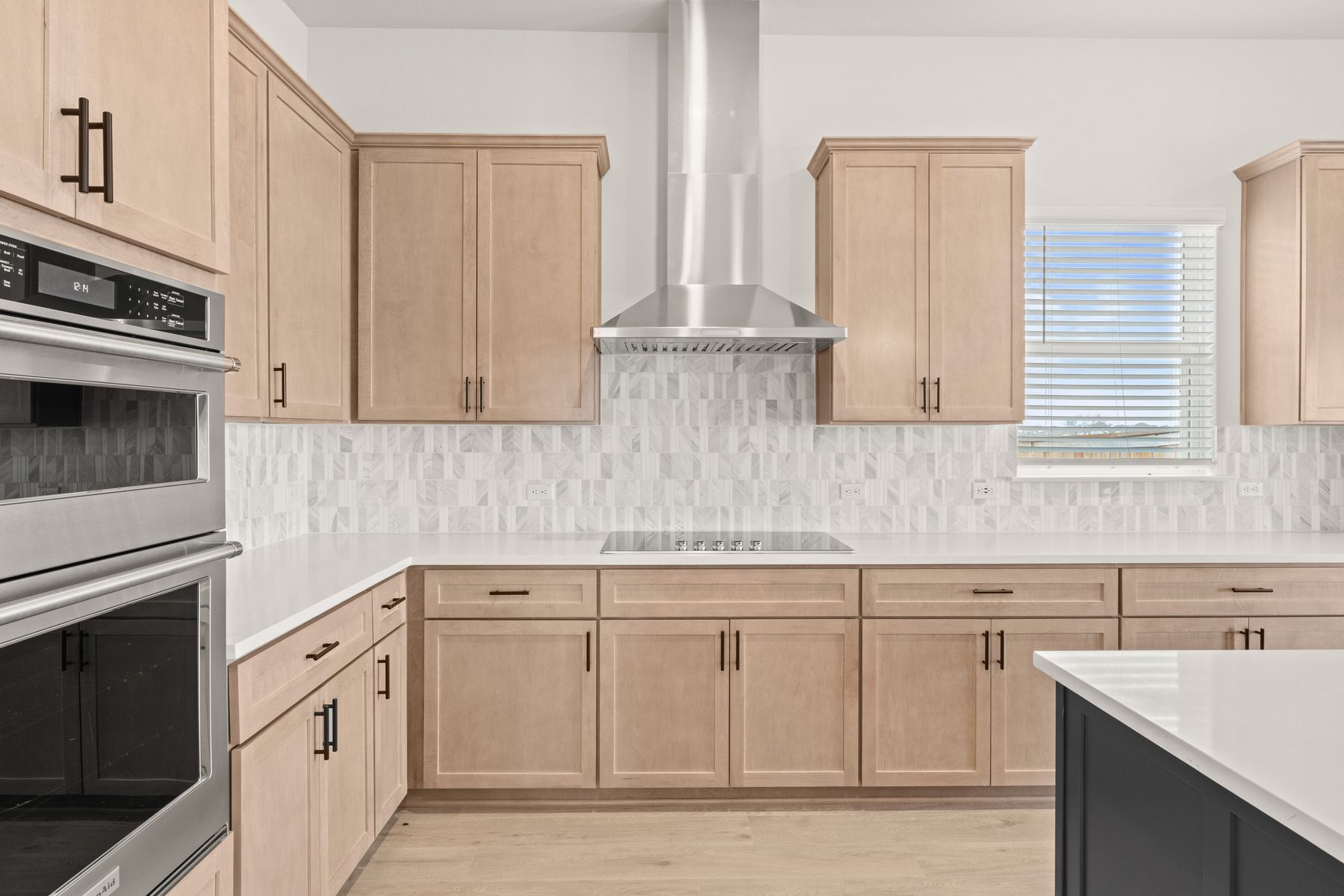The kitchen has a beautiful backsplash.