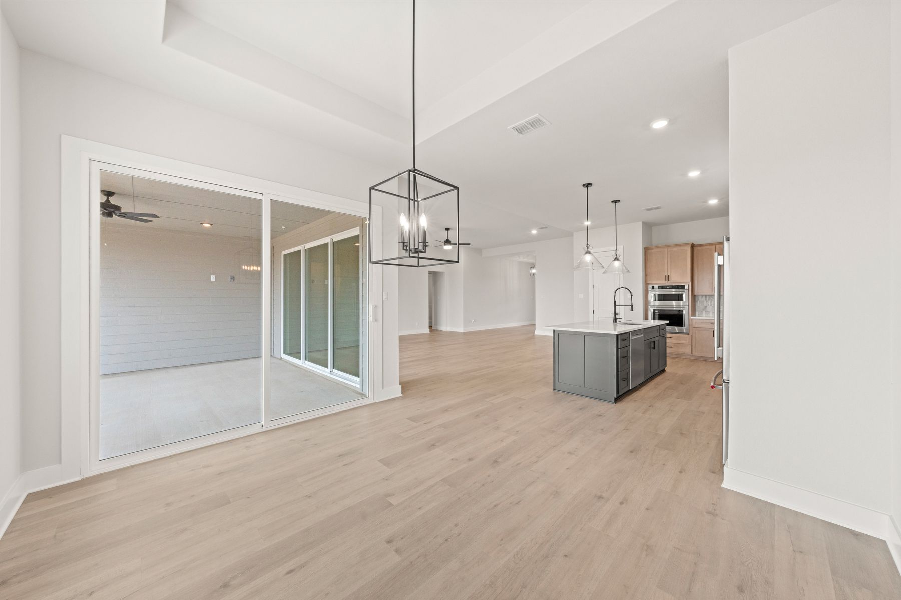 The dining room has large windows that let in great, natural light.