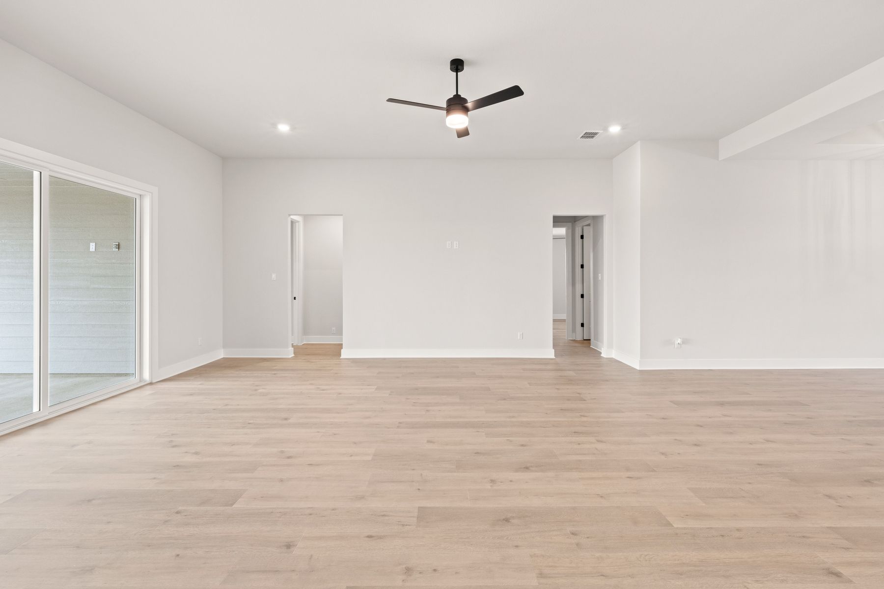 The family room is spacious and has room for everyone to have a seat.